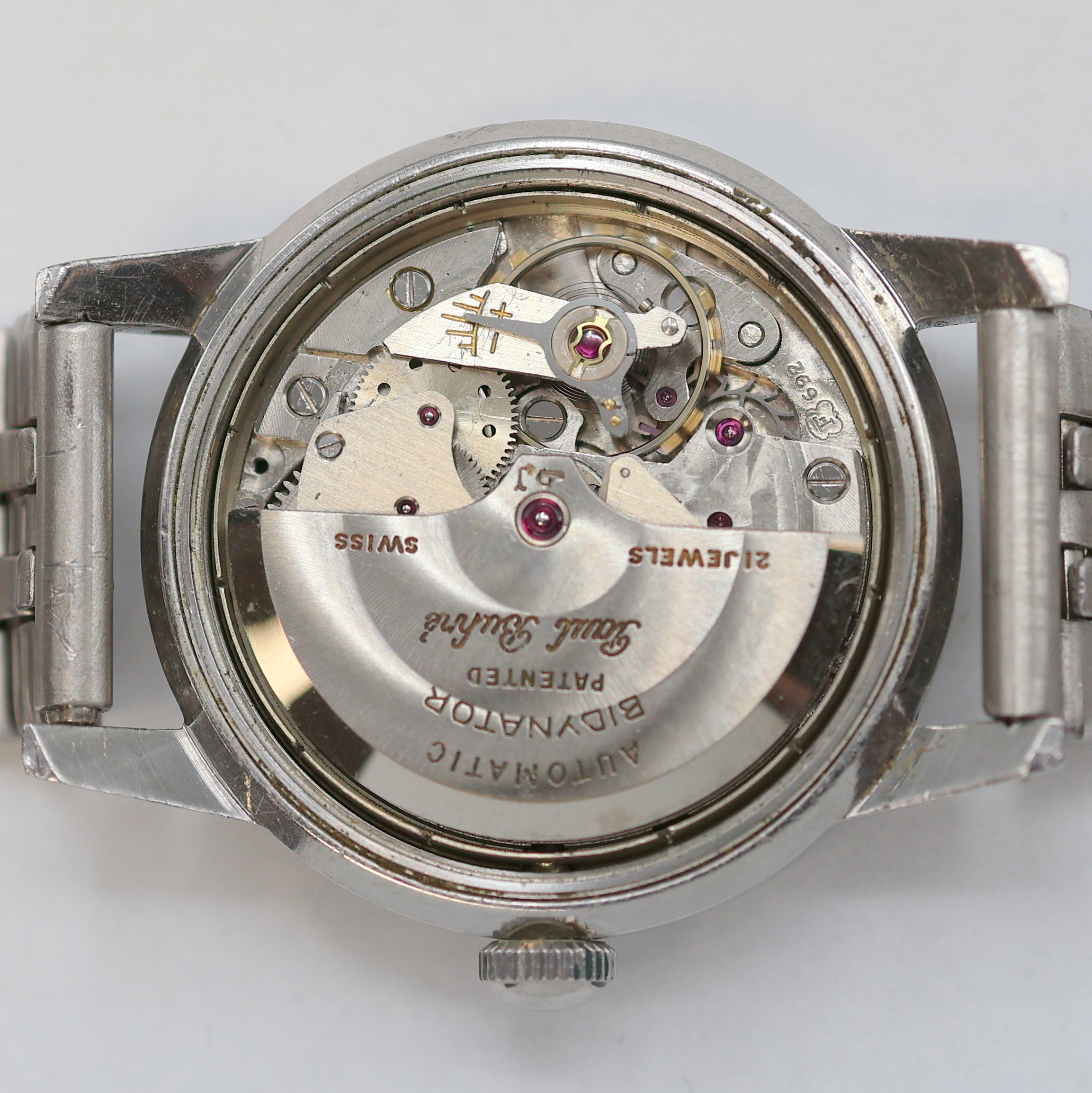 Detail h: PAUL BUHRE Armbanduhr RotoDatoR, Schweiz um 1957, Automatik, Edelstahlgeh. inkl. neutr. Gliederband, Boden verschr., vers. Zifferbl. m. aufges. ...