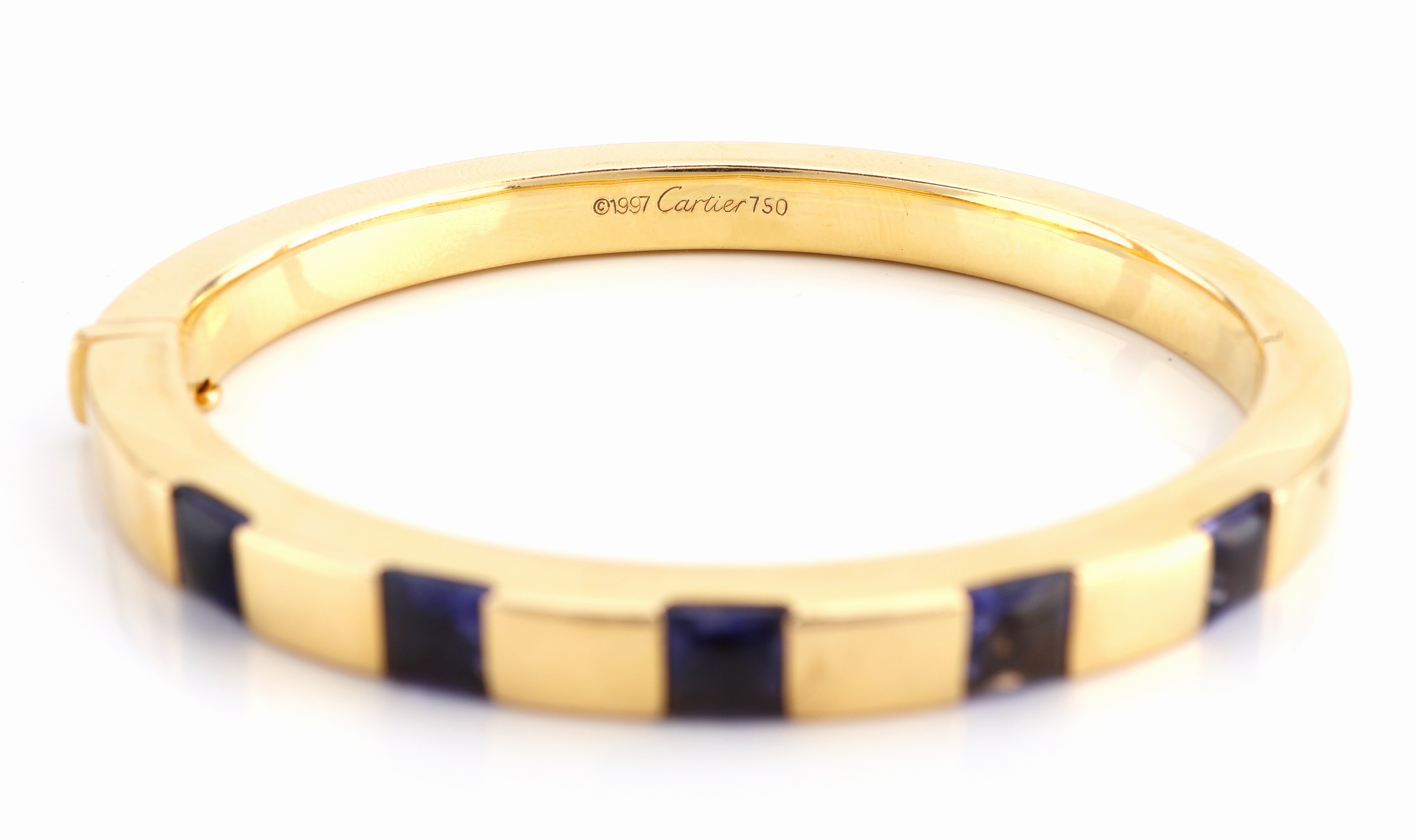 Detail b: 18 kt Gold CARTIER Iolith-Armreif, GG 750/000, 5 carreef. Iolithe im Bufftop Cut zus. ca. 5.0 ct, sign. und num., Kastenschlossmit ...