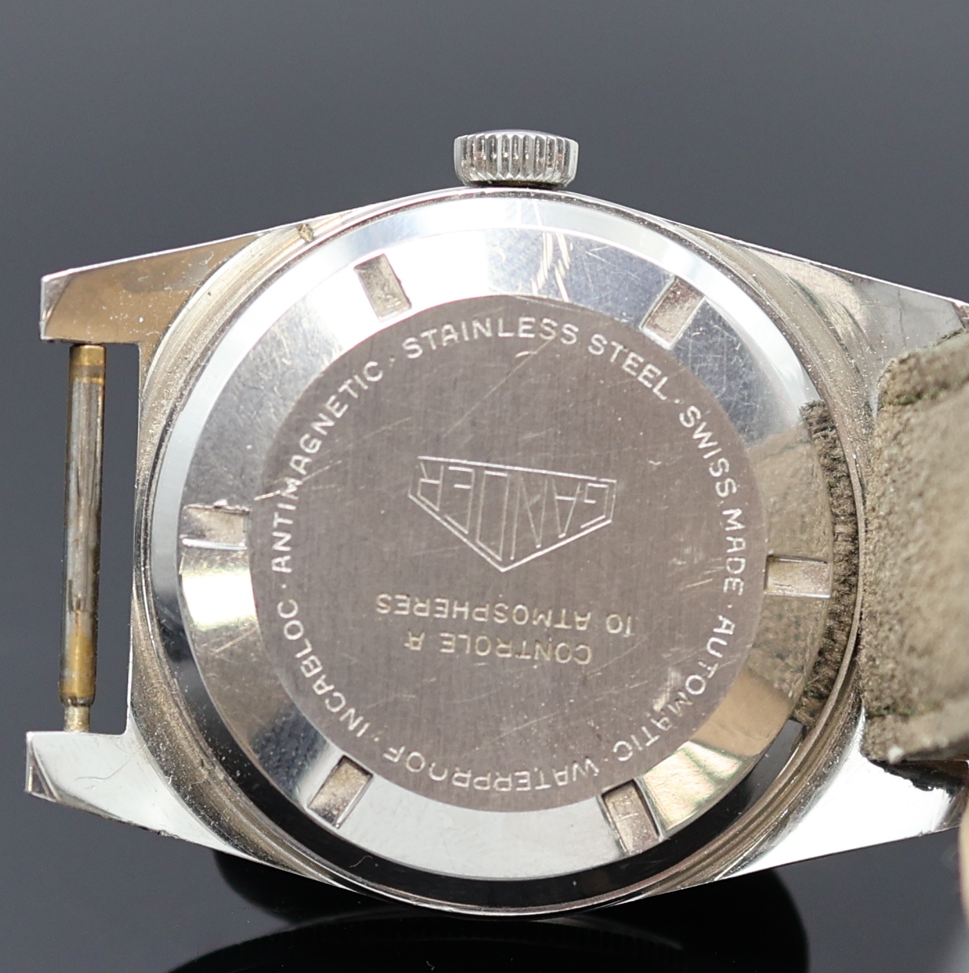 Detail c: GANDER Herrenarmbanduhr in Stahl, Schweiz um 1960, Automatik, Boden verschr., beids. drehb. Lünette m. 60er Teilung, schwarzes Zifferbl. m. ...