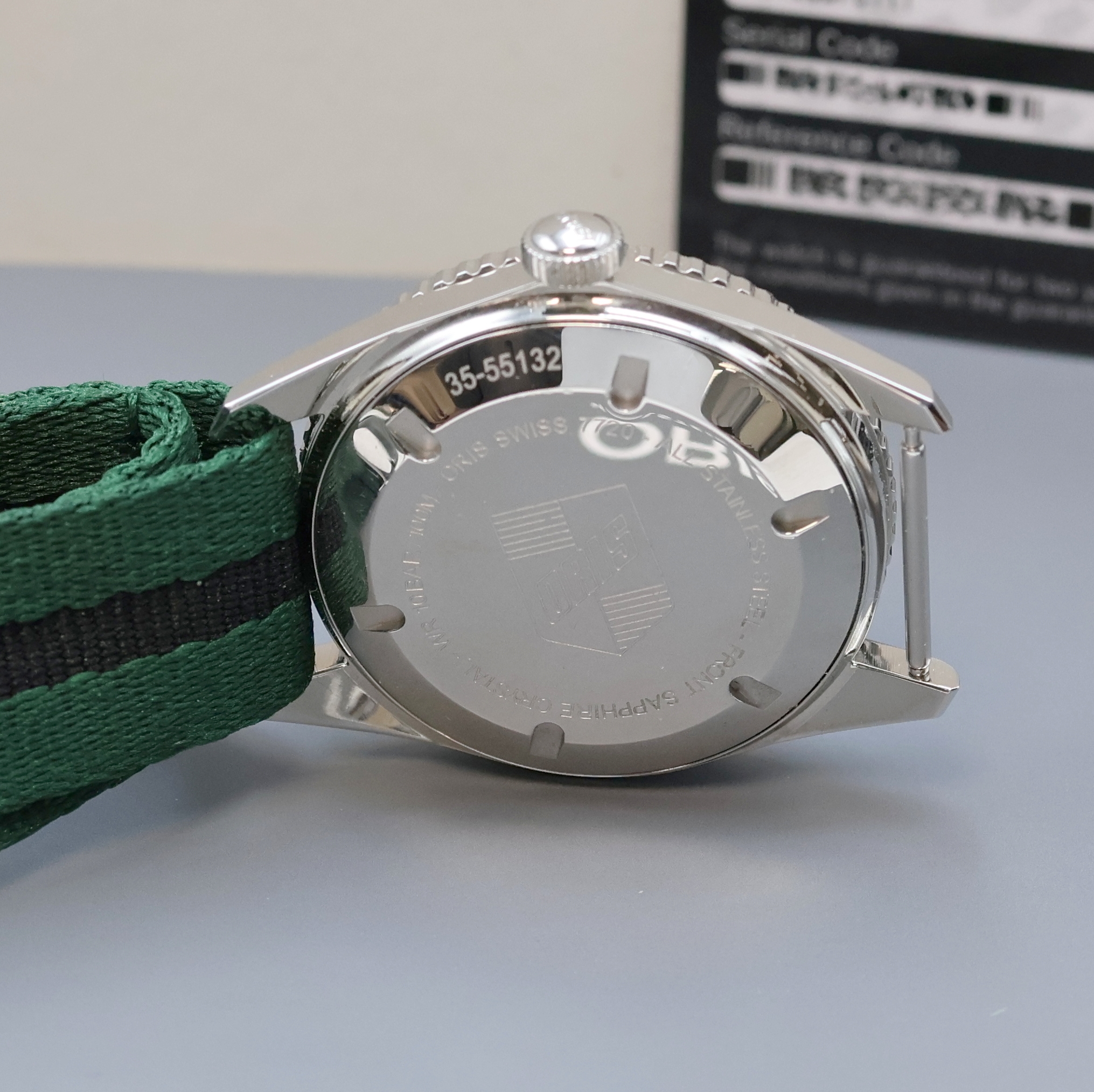 Detail e: ORIS Sixty Five Herrenarmbanduhr in Stahl Referenz 7720, Schweiz verk. lt. beil. Pap. 02/2017, Automatik, Textilband m. orig. Faltschl., Boden u. ...