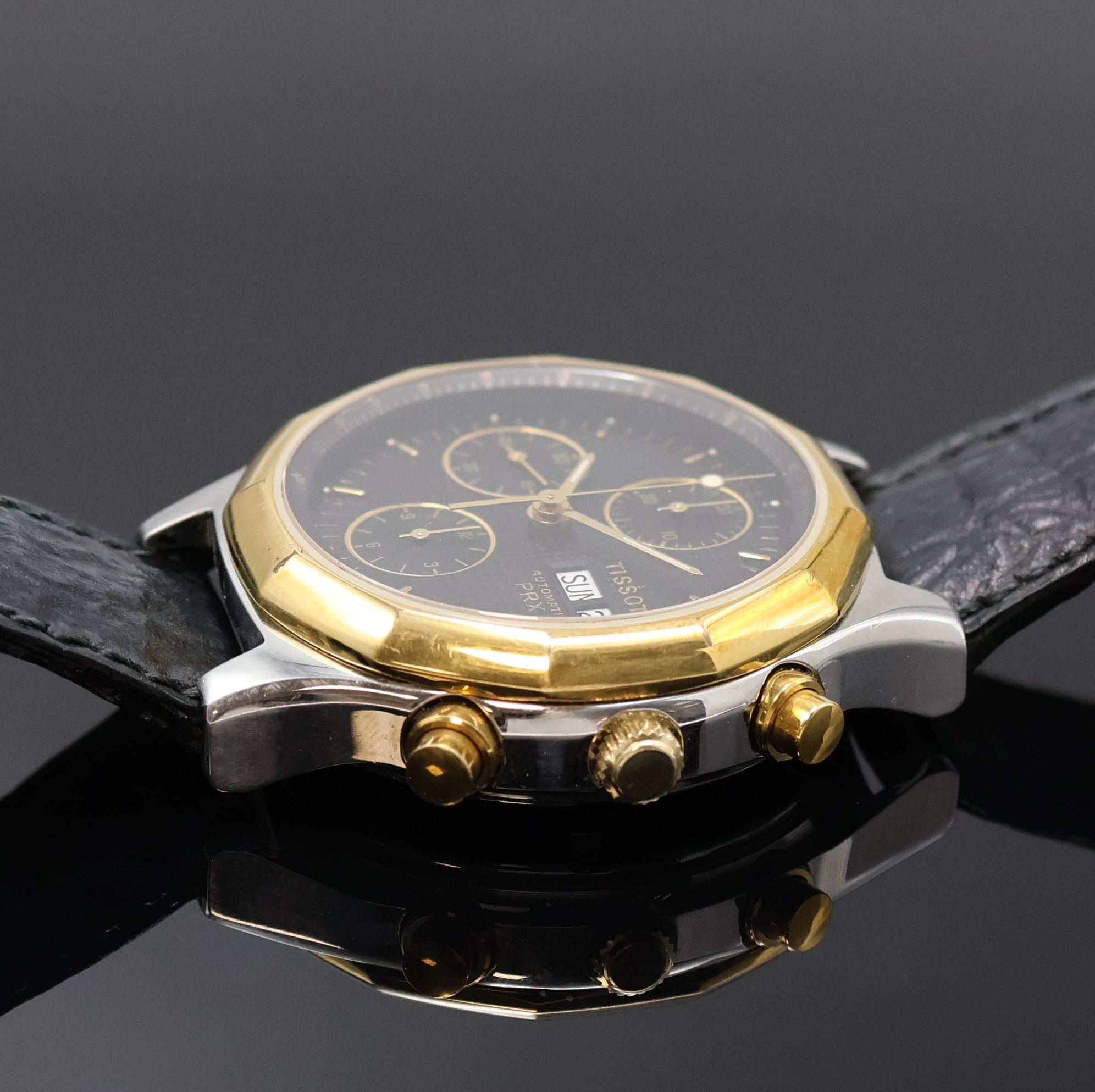 Detail b: TISSOT PRX Armbandchronograph Referenz P376, Schweiz um 1990, Automatik, Stahlgeh. m. verg. 12-eckiger Lünette, Boden verschr., schwarz. ...