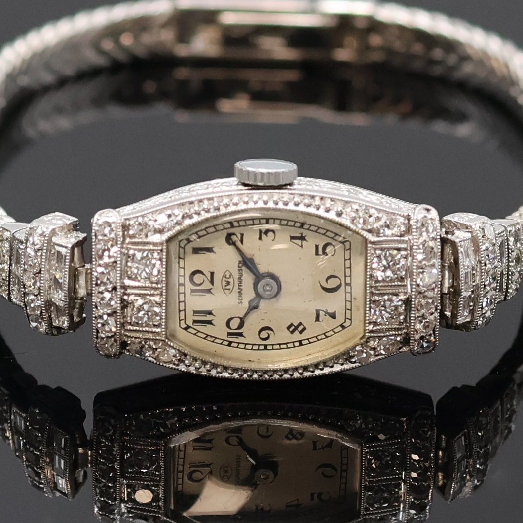 Detail a: IWC seltene diamantbesetzte Art-Deco Platin Damenarmbanduhr, Schweiz um 1928, Handaufzug, tonneau-förm. Scharniergeh., später anges. WG 750/000 ...