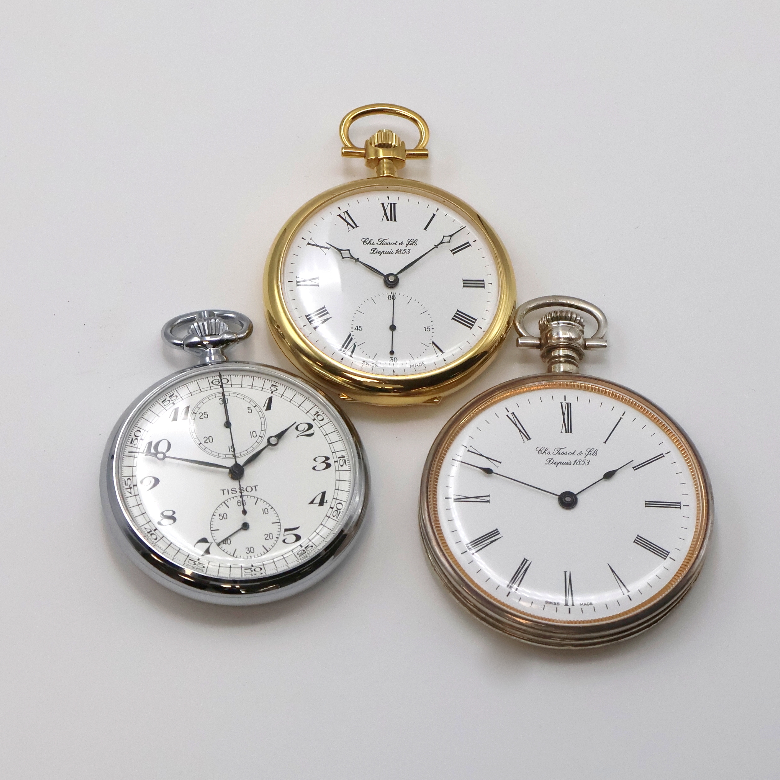 TISSOT 3 Taschenuhren, 1 x mit Chronograph, Schweiz um 1980, 1) Schaltradchronograph, beids. vergl. Geh., verchr., weißes Zifferbl., schwarze ...