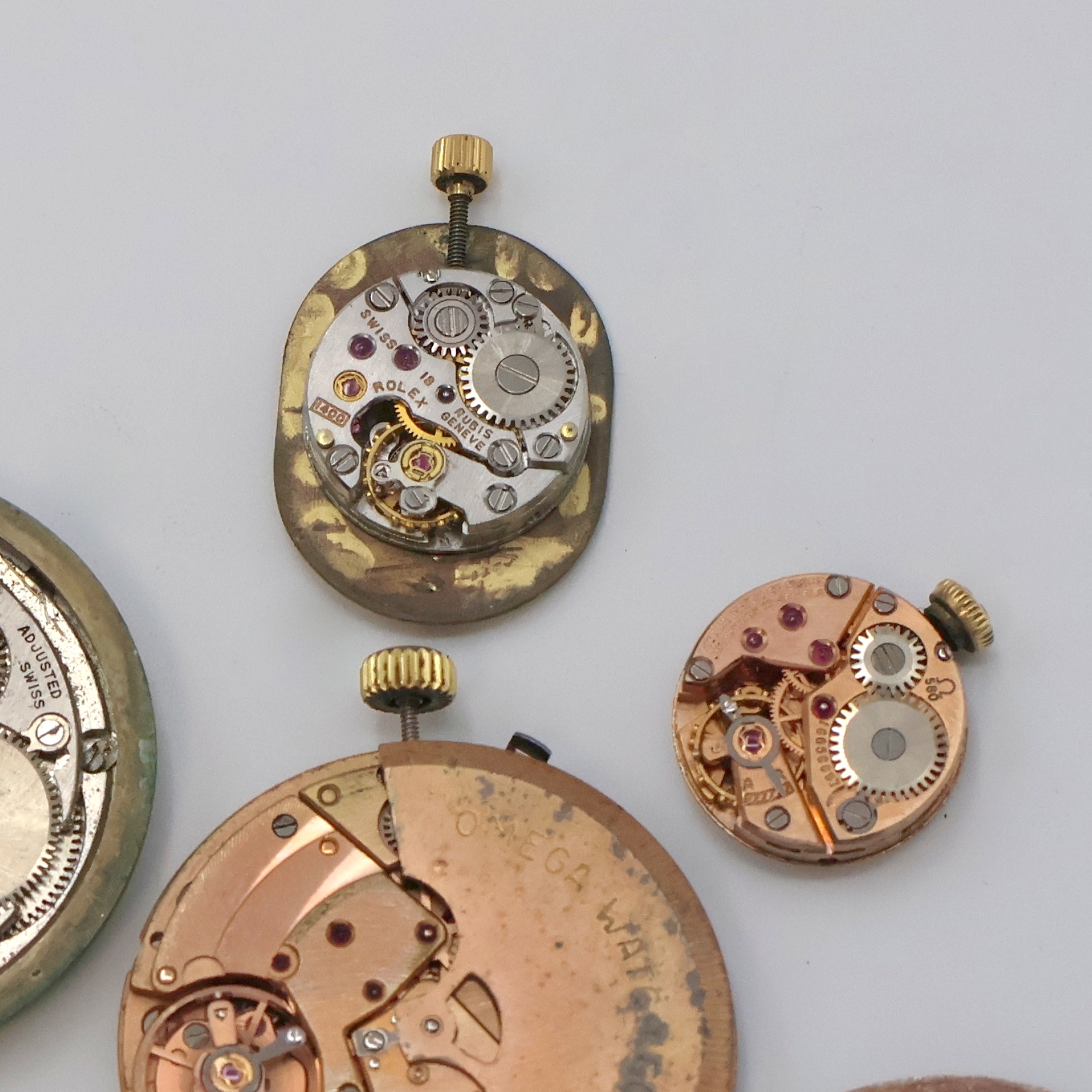 Detail c: PIAGET, ROLEX, IWC, OMEGA, GIRARD PERREGAUX 9 Armbanduhrwerke, Schweiz um 1950-2000, Automatik/Handaufzug, im einzelnen: OMEGA 1001, 712, 620, 2 x ...