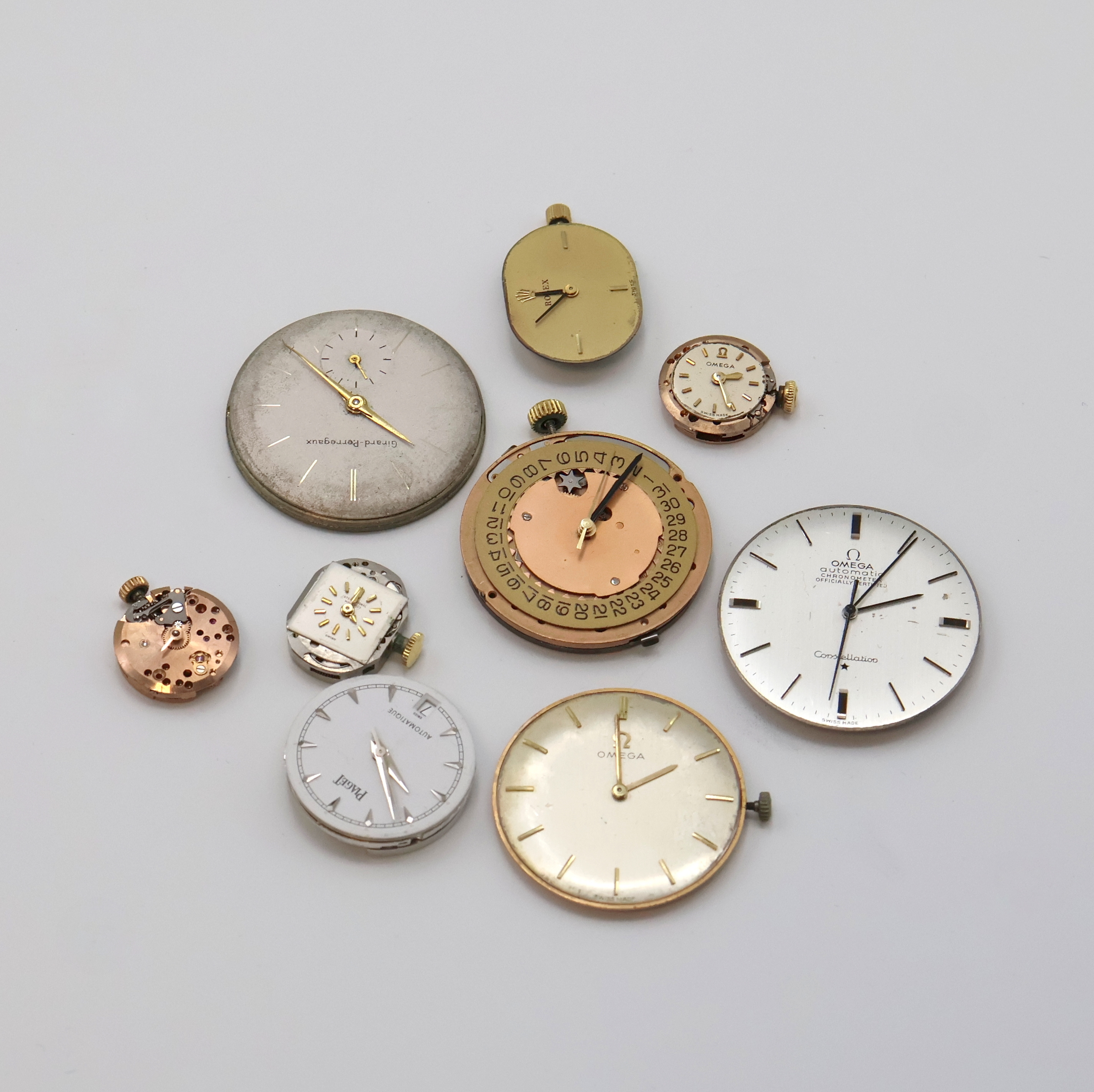 Detail d: PIAGET, ROLEX, IWC, OMEGA, GIRARD PERREGAUX 9 Armbanduhrwerke, Schweiz um 1950-2000, Automatik/Handaufzug, im einzelnen: OMEGA 1001, 712, 620, 2 x ...