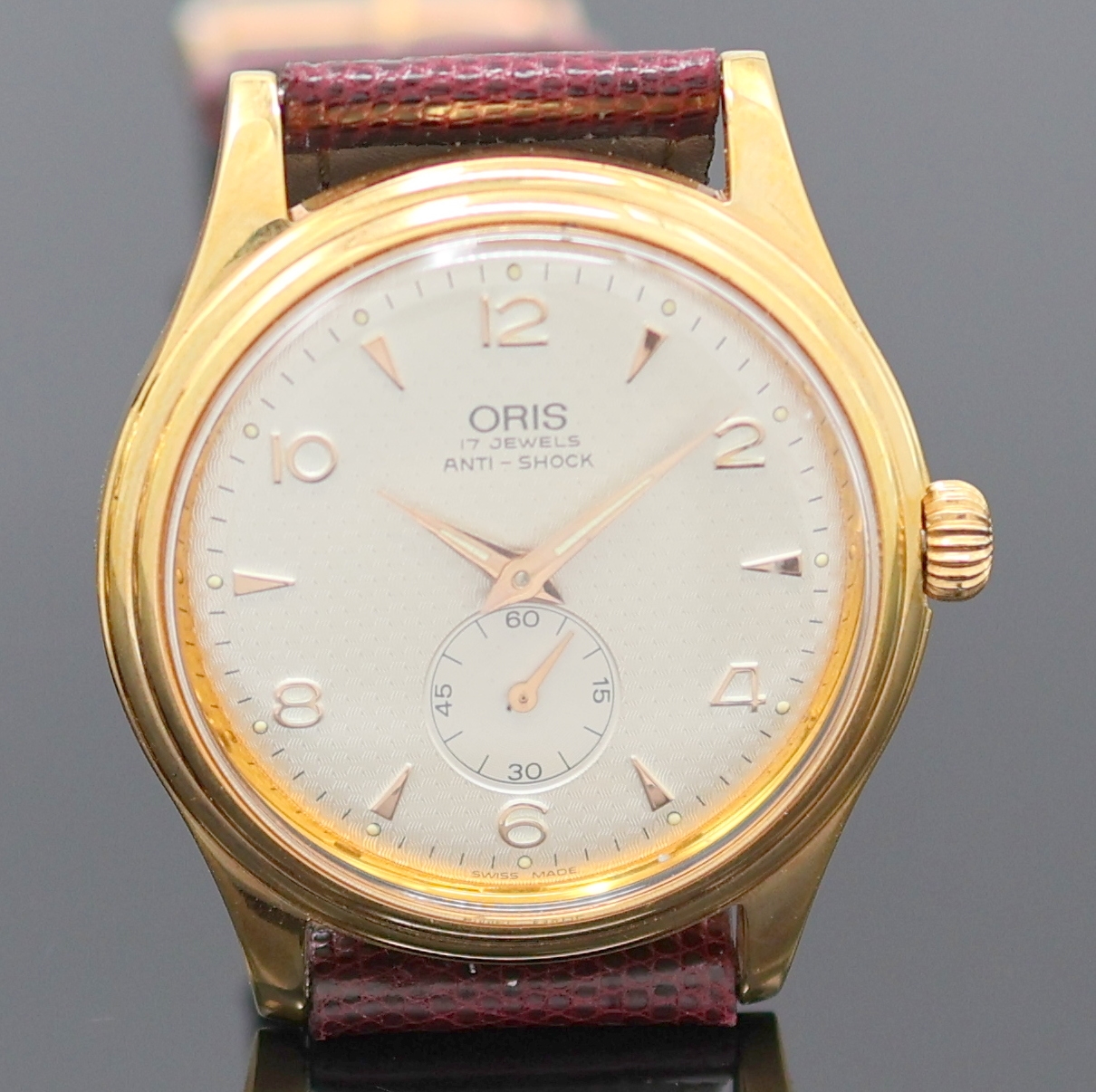 Detail b: ORIS 2 vergoldete Armbanduhren, Schweiz um 1990, Handaufzug, 1) Oris Armbandwecker, Boden verschr., silb. Duoton-Zifferbl. m. gold. Std.-Ind., ...