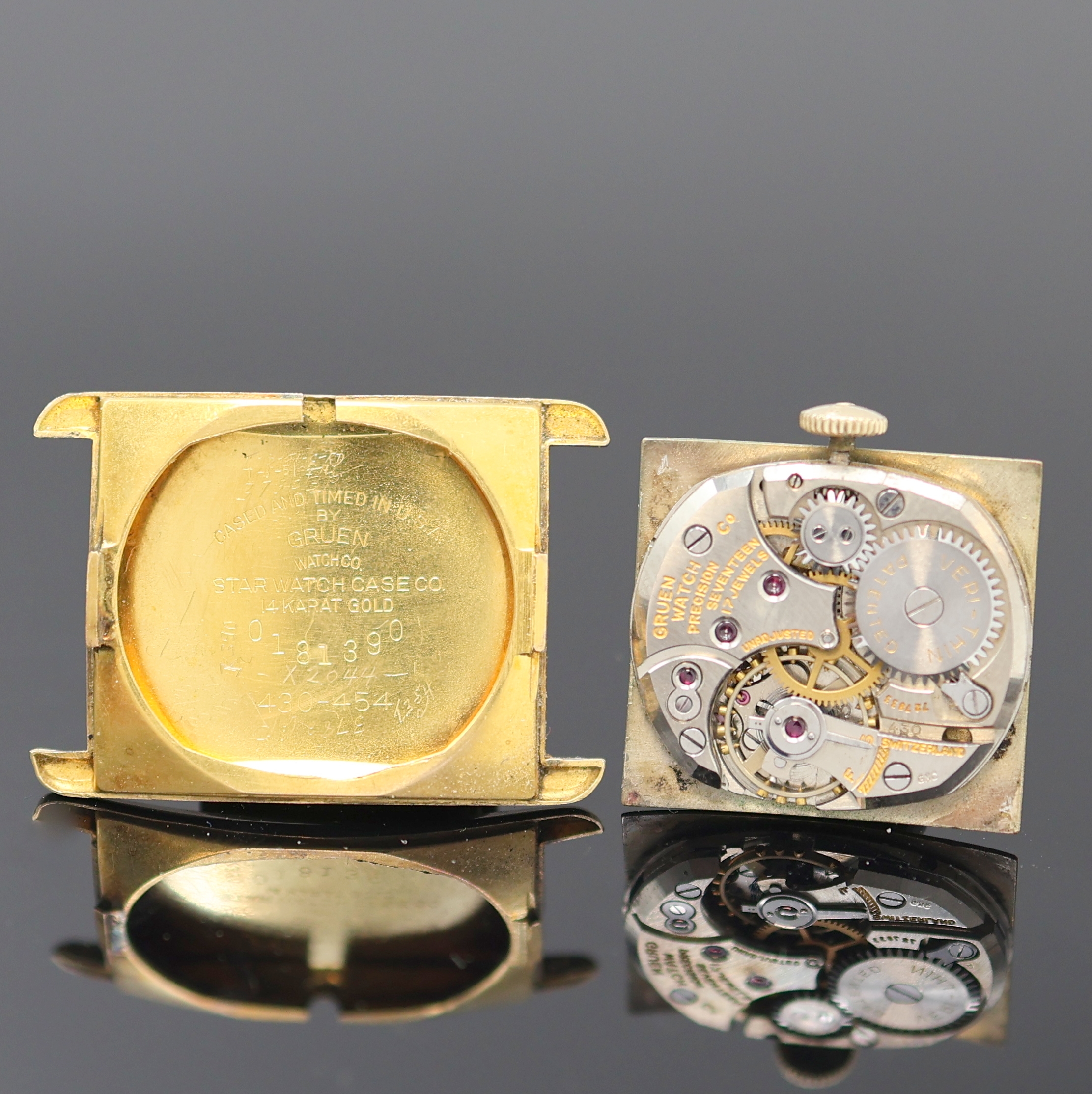Detail e: GRUEN Verithin rechteckige Armbanduhr in GG 585/000, USA um 1945, Handaufzug, Boden aufgedr., silb. Zifferbl. rest., arab. Zahlen u. gold. Std.-Ind., ...