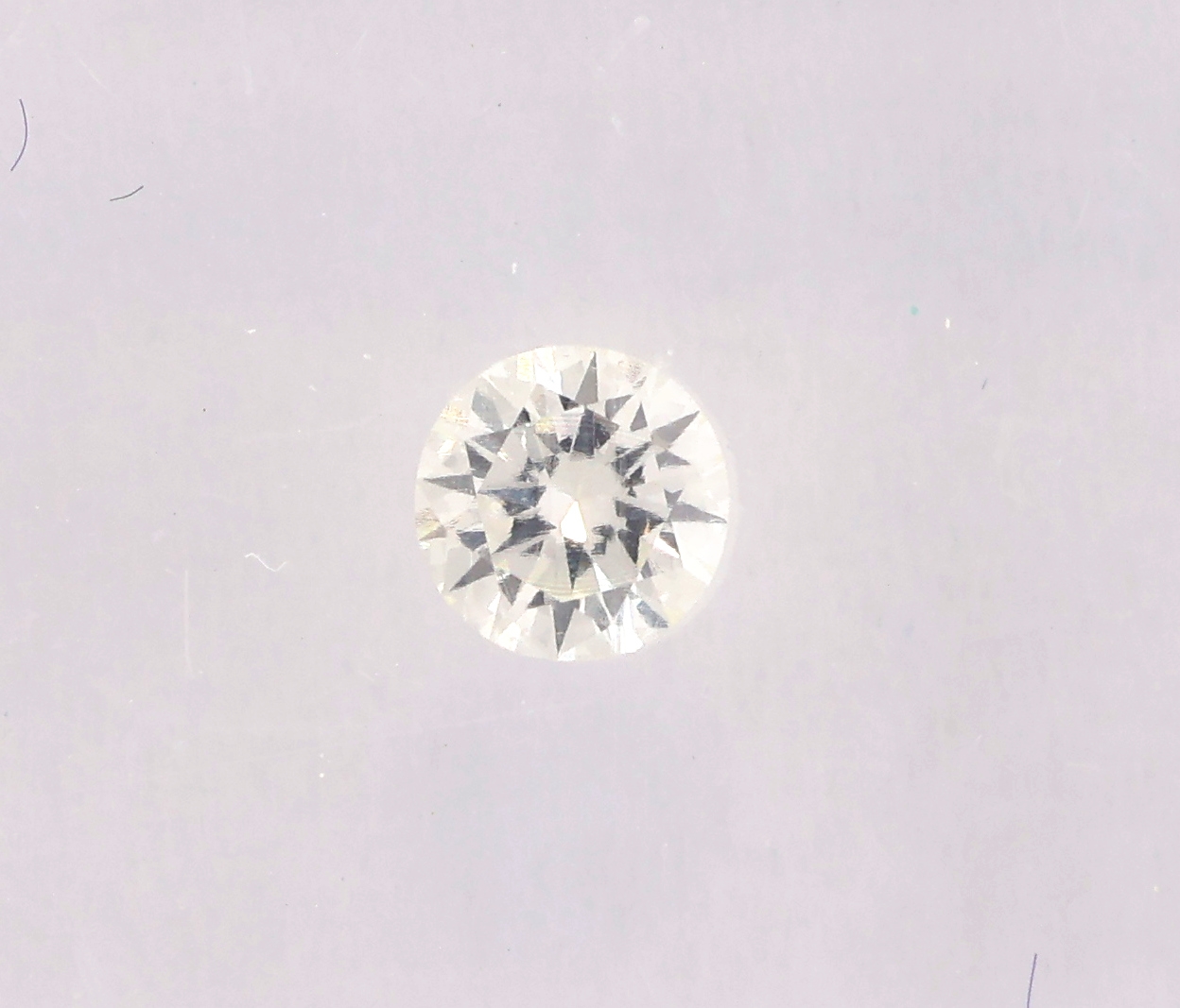Detail a: Loser Brillant, 0.24 ct feines Weiß(G)/lr, eingeschweißt, mit IGI-Expertise
