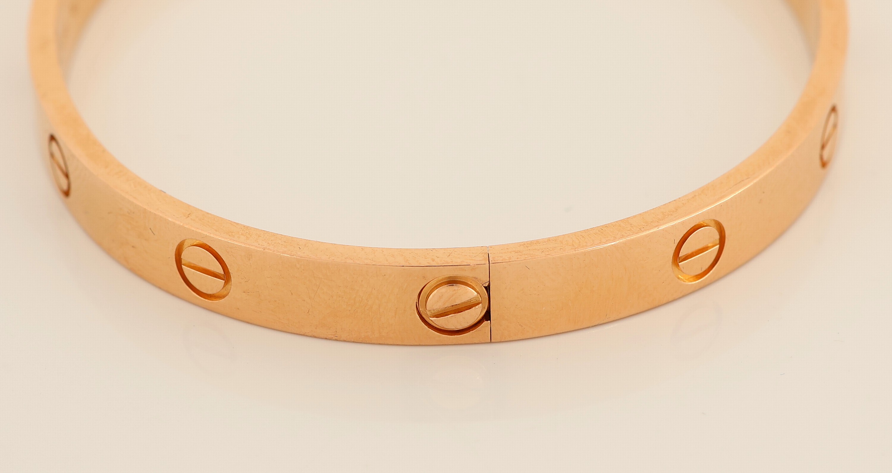 Detail c: 18 kt Gold CARTIER Armreif, RoseG 750/000, aus der LOVE-Serie, ca. 6.5 x 5.5 cm, sign. und num., mit orig. Schraubenzieher, Etui, Zertifikat und ...