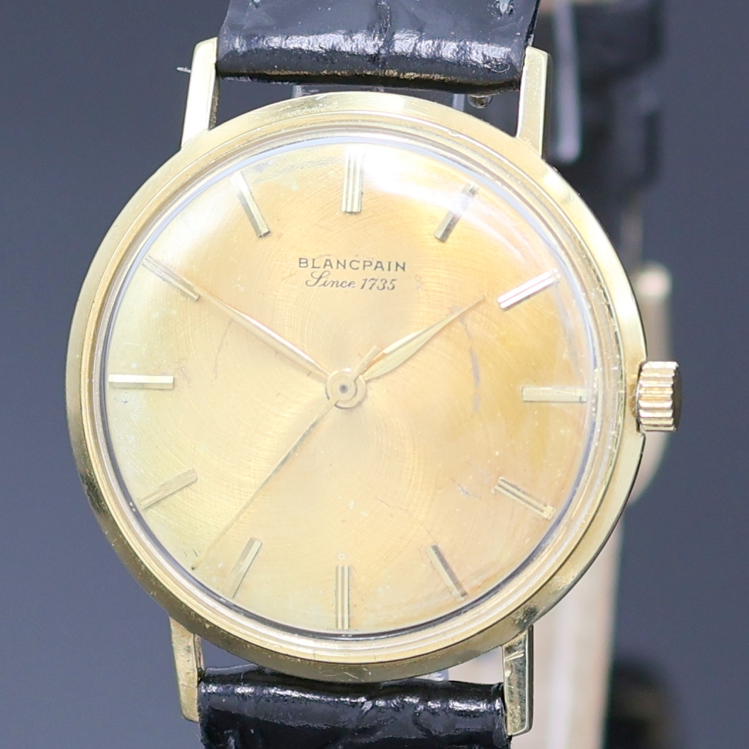 Detail a: BLANCPAIN Armbanduhr in GG 750/000, Schweiz um 1970, Automatik, Monocoque-Geh., goldfarb. Zifferbl. m. aufges. gold. Std.-Ind. fl., gold. Zeiger, ...