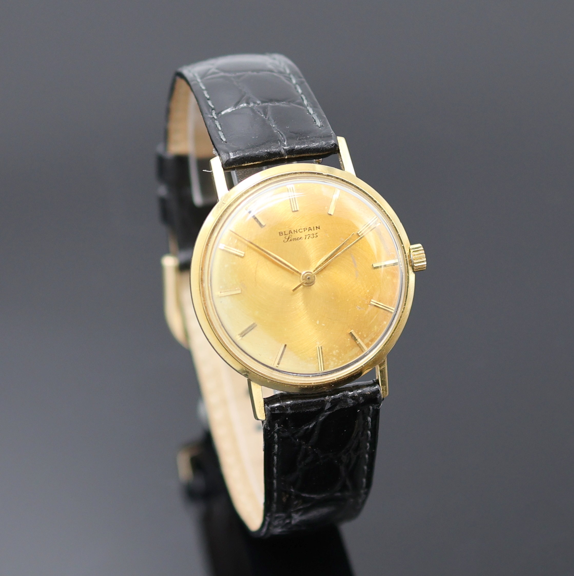 Detail b: BLANCPAIN Armbanduhr in GG 750/000, Schweiz um 1970, Automatik, Monocoque-Geh., goldfarb. Zifferbl. m. aufges. gold. Std.-Ind. fl., gold. Zeiger, ...
