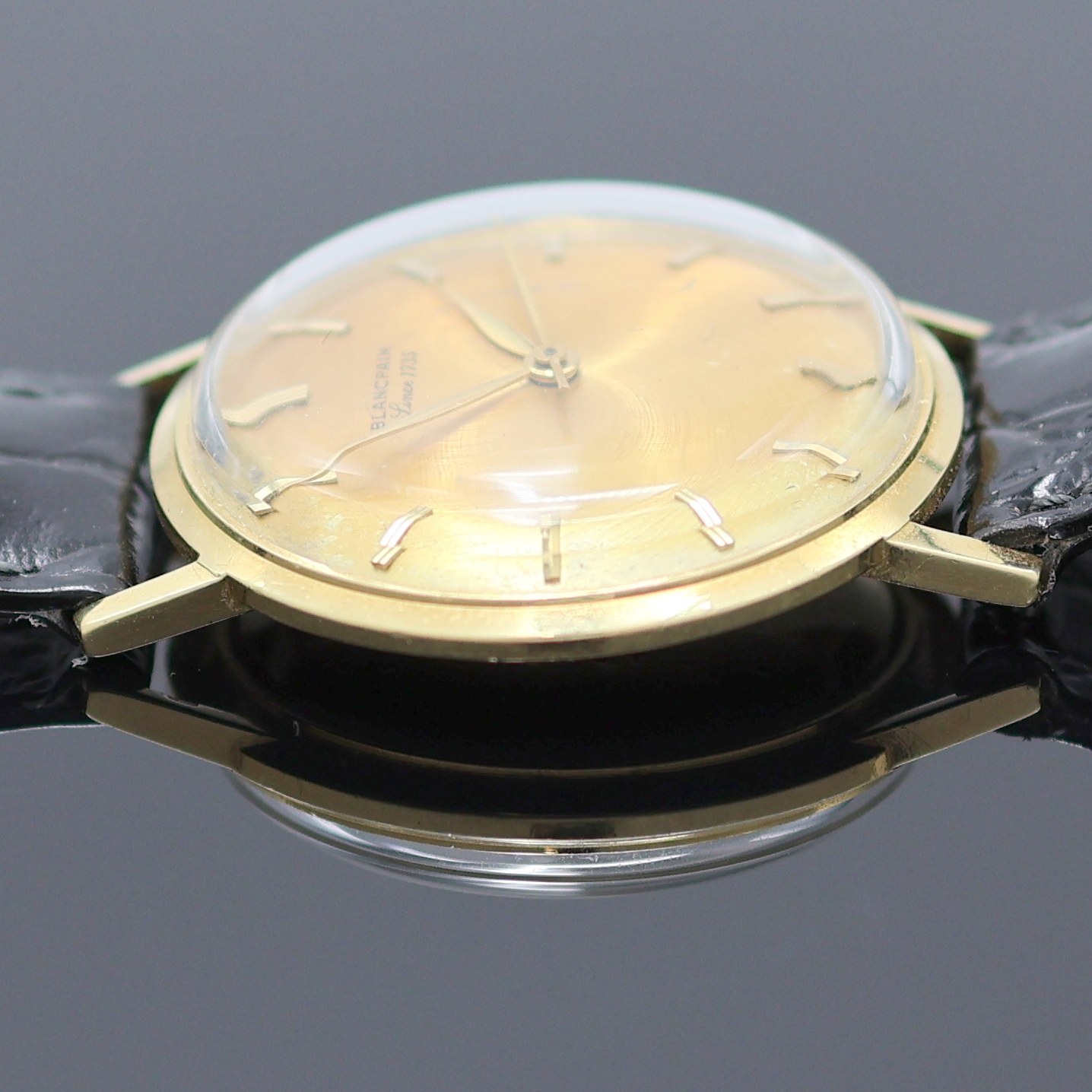 Detail e: BLANCPAIN Armbanduhr in GG 750/000, Schweiz um 1970, Automatik, Monocoque-Geh., goldfarb. Zifferbl. m. aufges. gold. Std.-Ind. fl., gold. Zeiger, ...