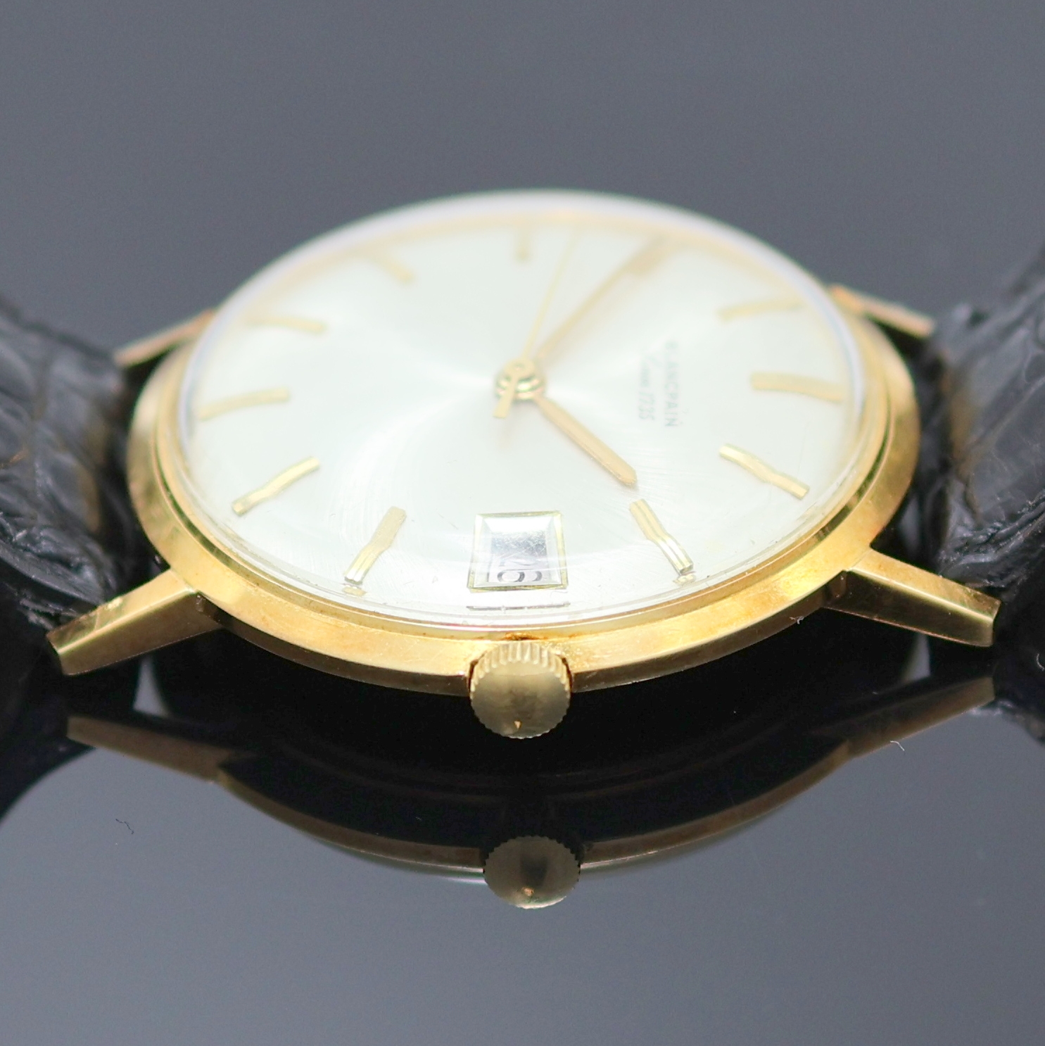 Detail d: BLANCPAIN Armbanduhr in GG 750/000, Schweiz um 1970, Automatik, Monocoque-Geh., silb. Zifferbl. m. aufges. gold. Std.-Ind., gold. Zeiger, Datum b. 3, ...