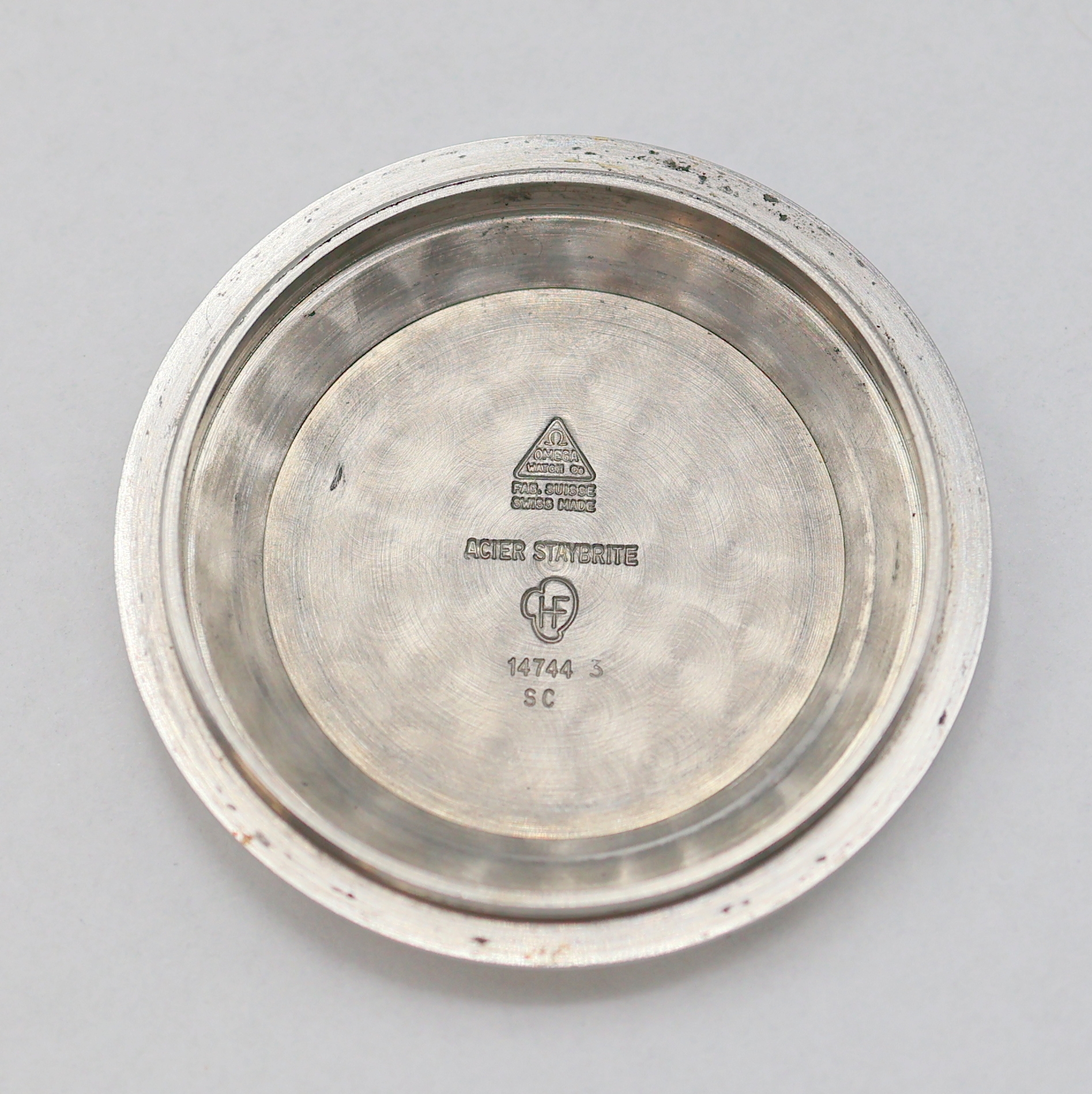 Detail i: OMEGA Seamaster Armbanduhr in Stahl Referenz 14744, Schweiz um 1961, Automatik, verschr. Boden m. Seamaster-Logo, silb. Zifferbl. fl./pat., aufges. ...