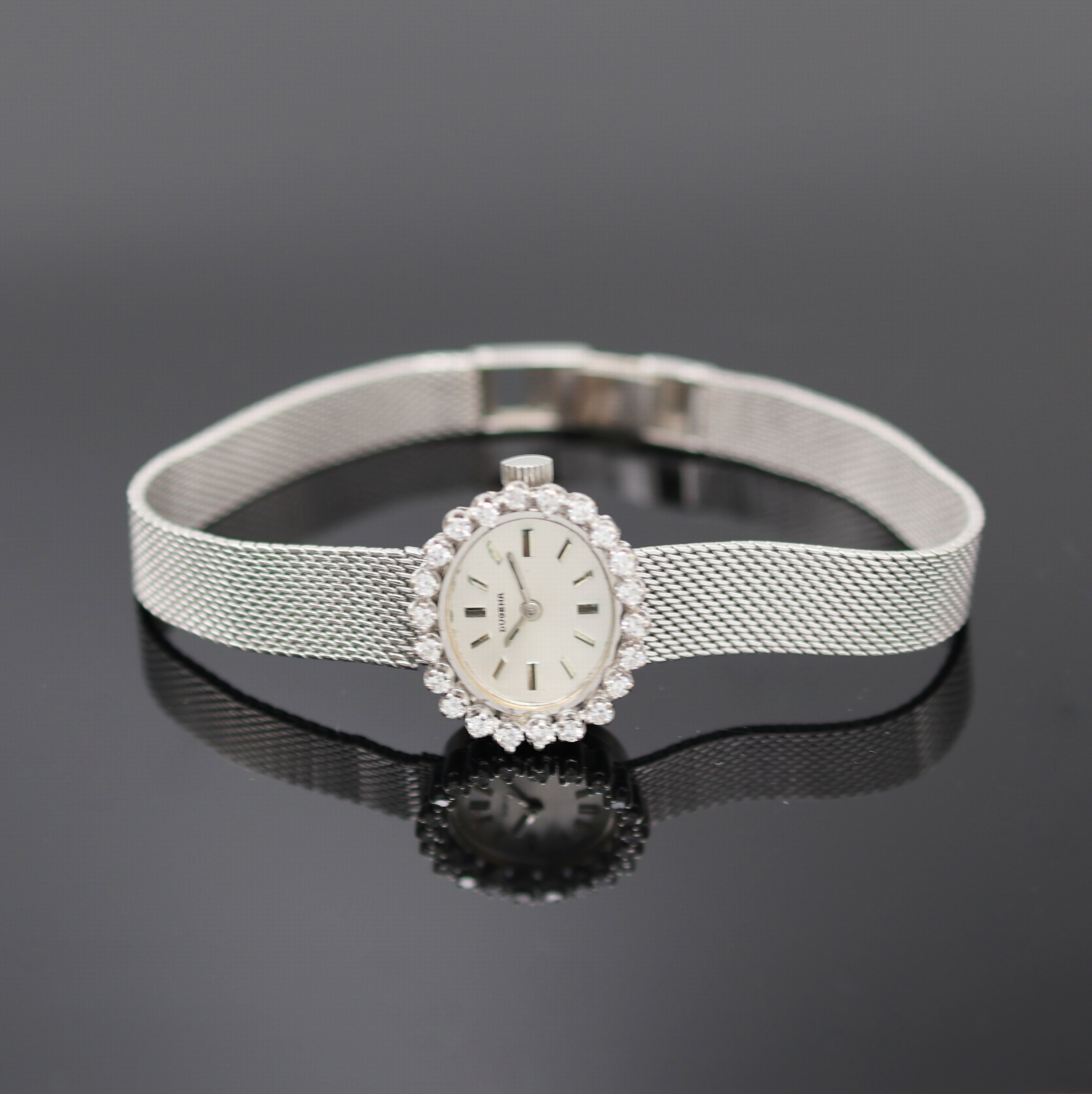 DUGENA diamantbesetzte Damenarmbanduhr in WG 585/000, Deutschland/Schweiz um 1970, Handaufzug, 2-tlg. Geh., Boden aufgedr., anges. Milanaiseband in ...