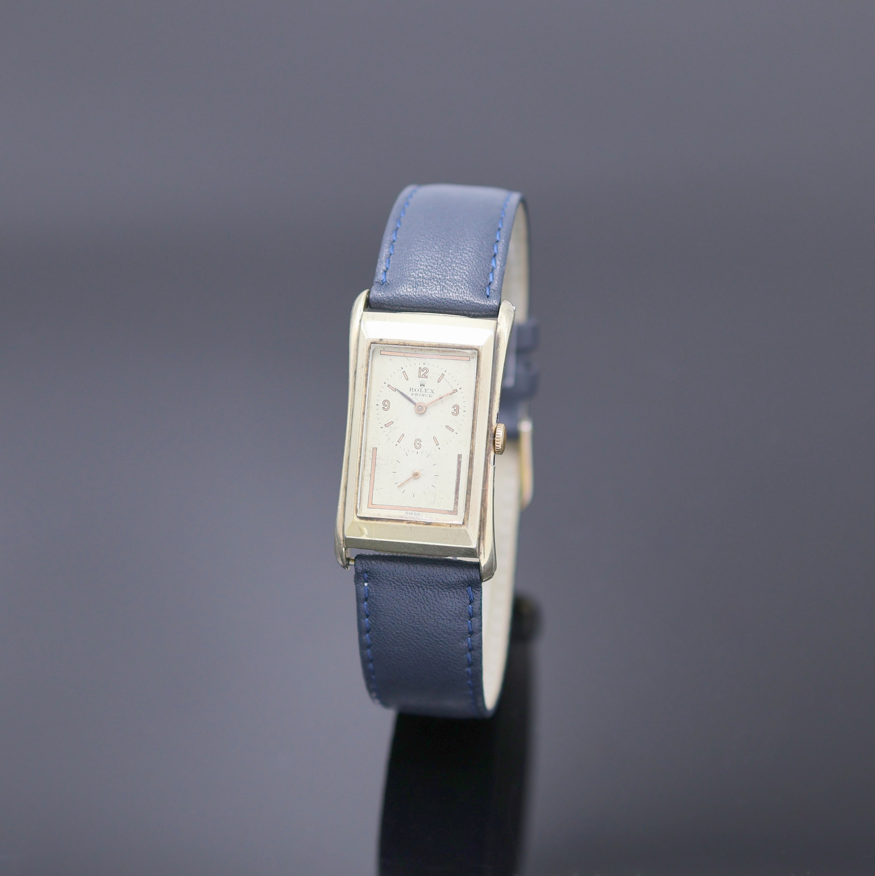 ROLEX Prince Armbanduhr Referenz 1490, Schweiz um 1935, Handaufzug, rechteckiges, teilw. verg. Stahlgeh., Boden aufgedr., silb. Zifferbl. ...