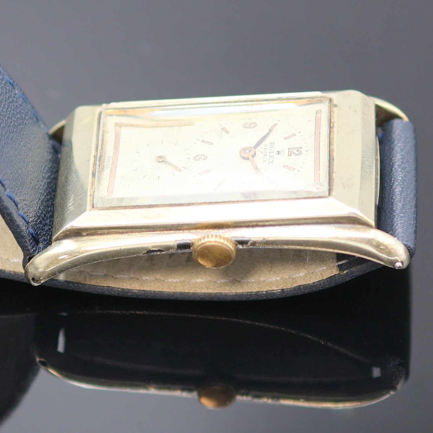 Detail d: ROLEX Prince Armbanduhr Referenz 1490, Schweiz um 1935, Handaufzug, rechteckiges, teilw. verg. Stahlgeh., Boden aufgedr., silb. Zifferbl. ...
