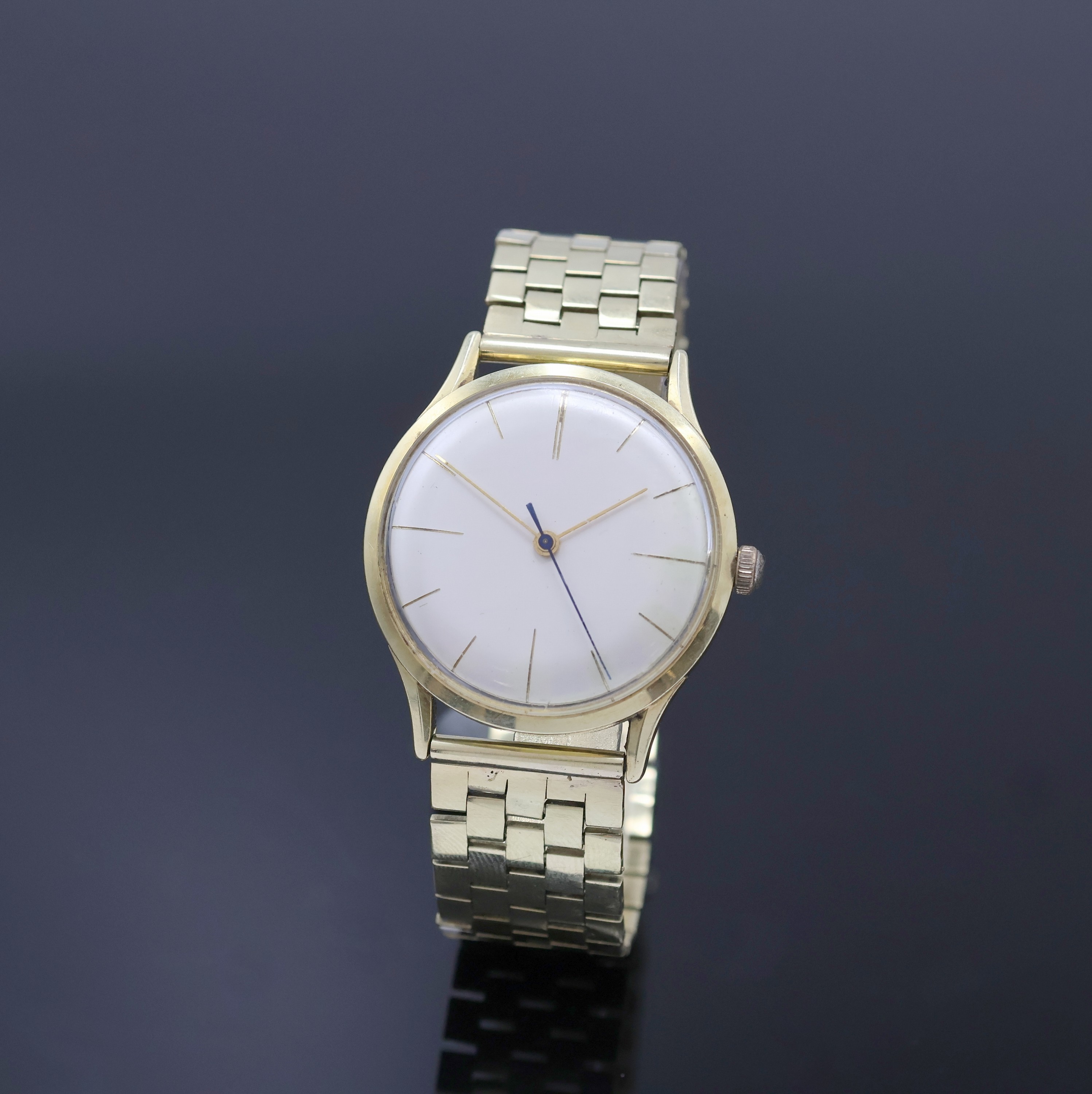 Armbanduhr mit schweren Goldband in GG 585/000, Schweiz um 1960, Automatik, Boden verschr., abnehmbares Band m. Faltschl., silb. Zifferbl. m. gold. ...