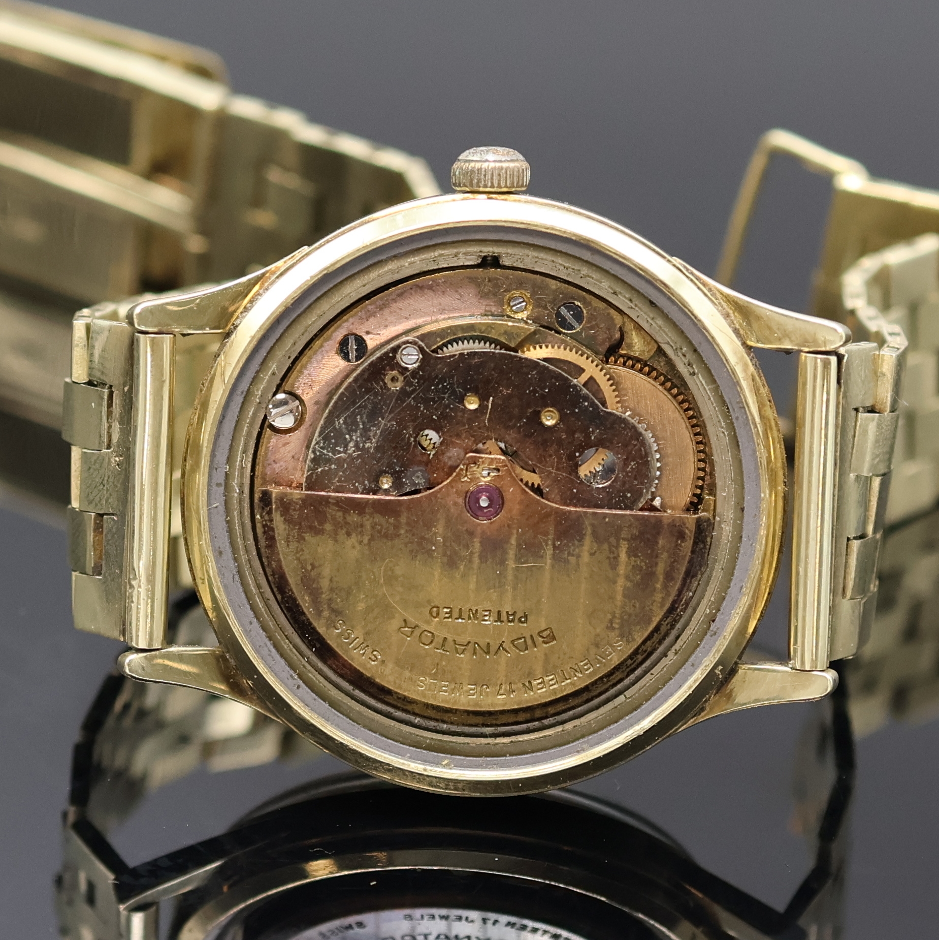 Detail e: Armbanduhr mit schweren Goldband in GG 585/000, Schweiz um 1960, Automatik, Boden verschr., abnehmbares Band m. Faltschl., silb. Zifferbl. m. gold. ...
