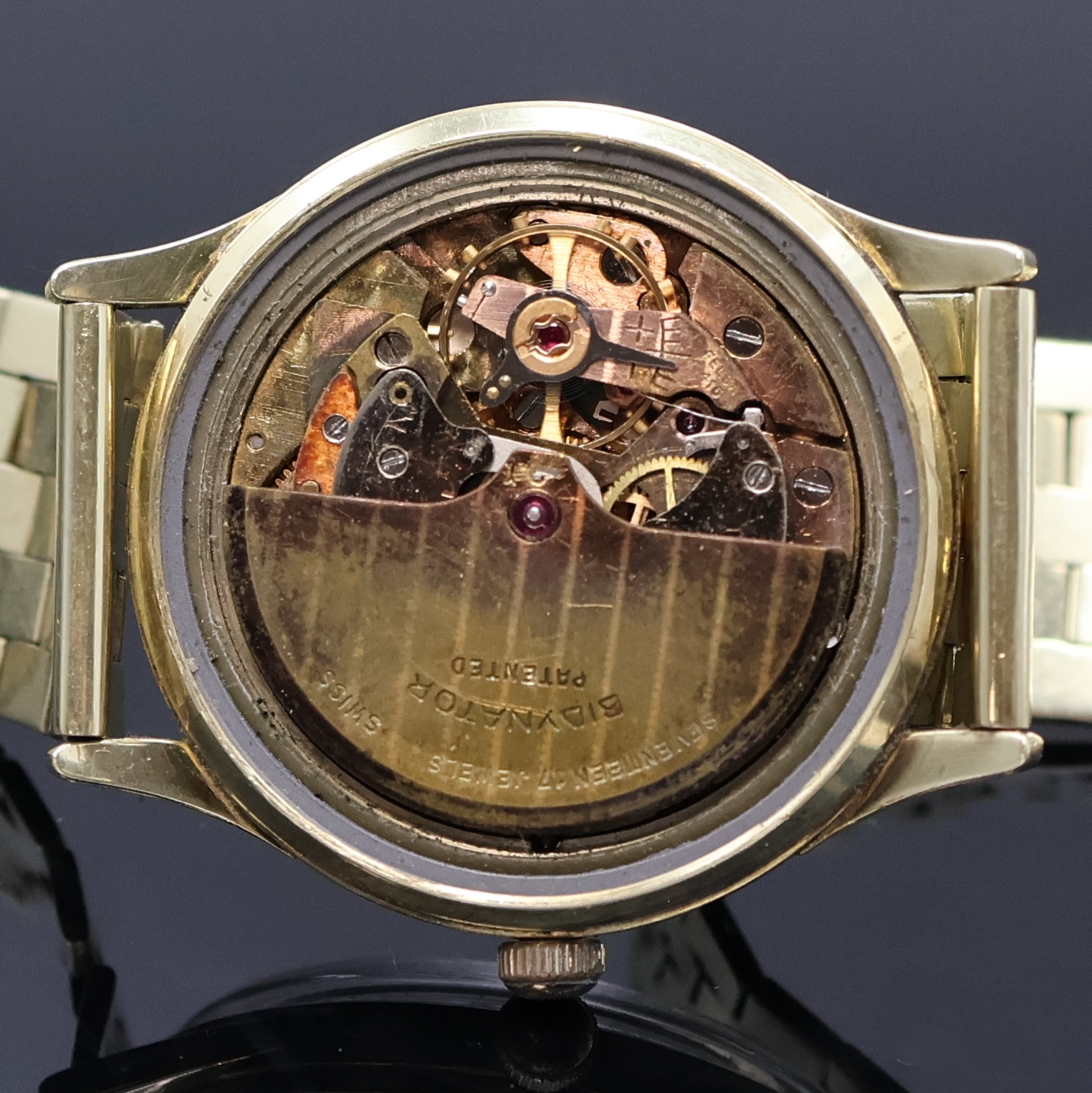 Detail f: Armbanduhr mit schweren Goldband in GG 585/000, Schweiz um 1960, Automatik, Boden verschr., abnehmbares Band m. Faltschl., silb. Zifferbl. m. gold. ...