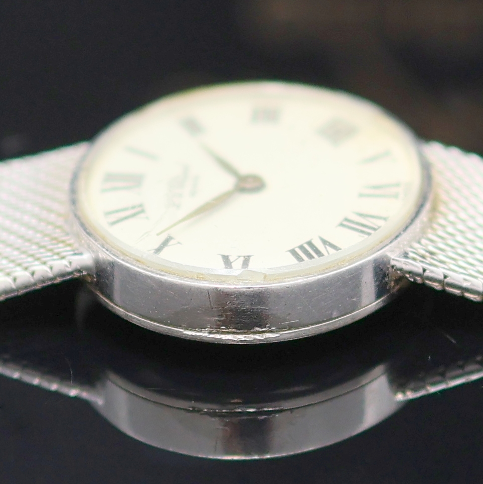 Detail e: CHOPARD Damenarmbanduhr in WG 750/000, Schweiz um 1970, Handaufzug, Boden aufgedr., orig Goldband, Glas besch., silb. Zifferbl. fl., röm. Zahlen, ...