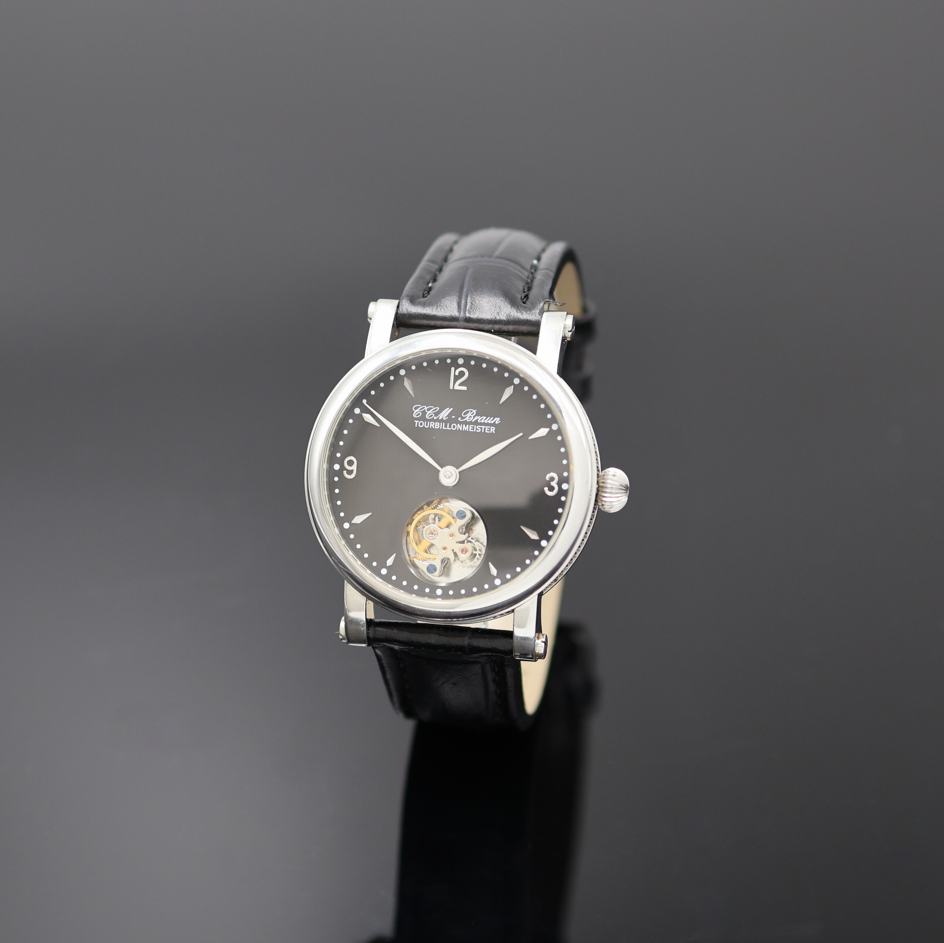 CCM BRAUN Tourbillonmeister Armbanduhr in Stahl, Asien um 2006, Handaufzug, beids. vergl. Geh. m. geripptem Rand, Boden bez. "Tourbillonseminar ...