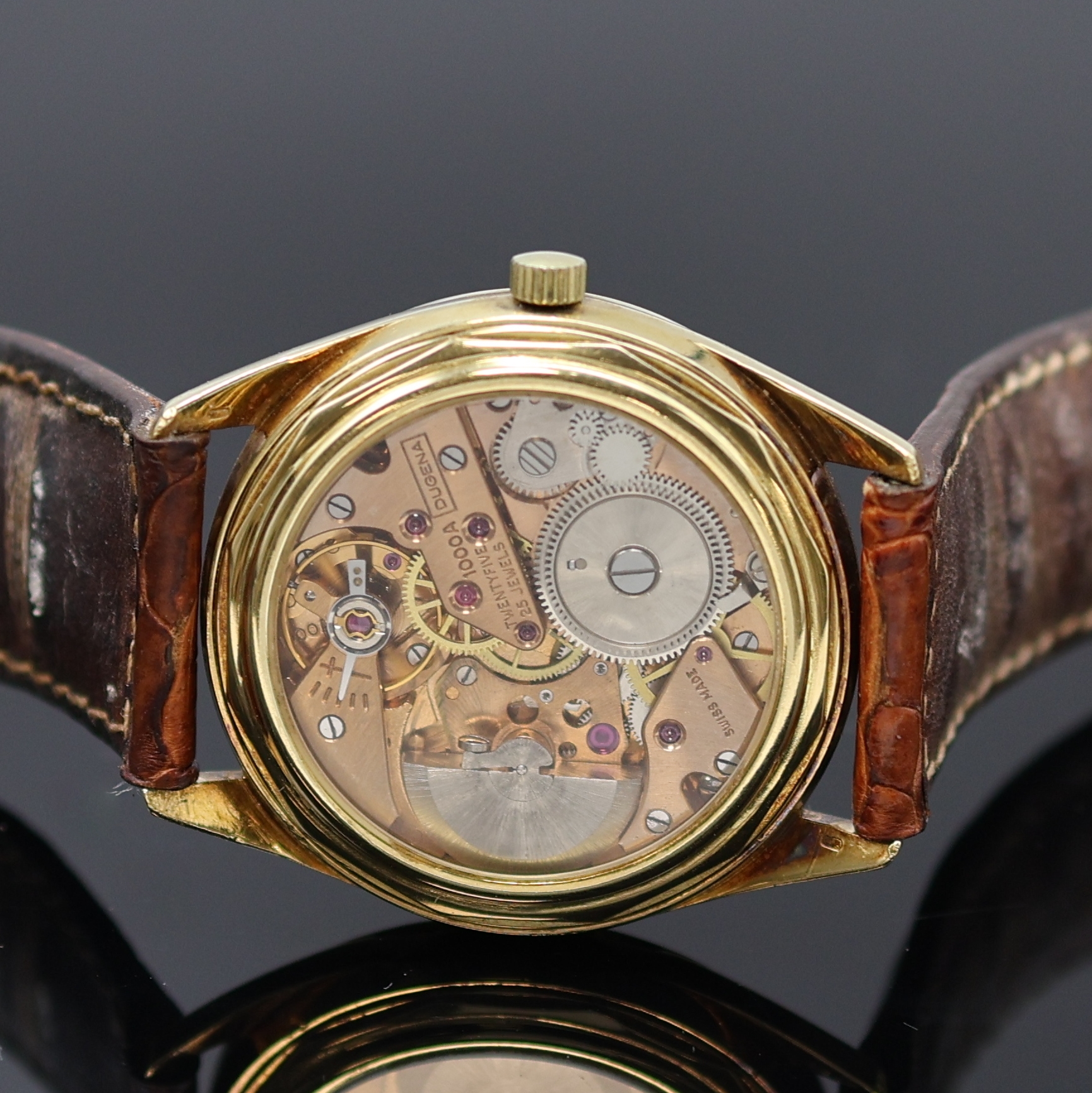 Detail c: DUGENA Armbanduhr in GG 585/000, Schweiz um 1960, Automatik, 3-tlg. Geh., verschr. Glasboden später, silb. Zifferbl. rest., gold. Indizes u. Zeiger, ...