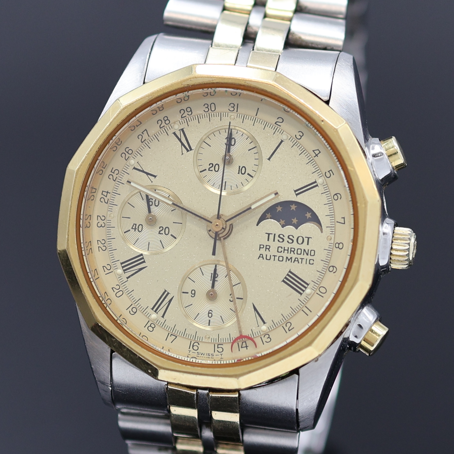 Detail a: TISSOT PR 100 Herrenchronograph in Stahl/ vergoldet, Schweiz um 1980, Automatik, verschr. Geh., 12-eckig facettierte Lünette, orig. Band m. ...