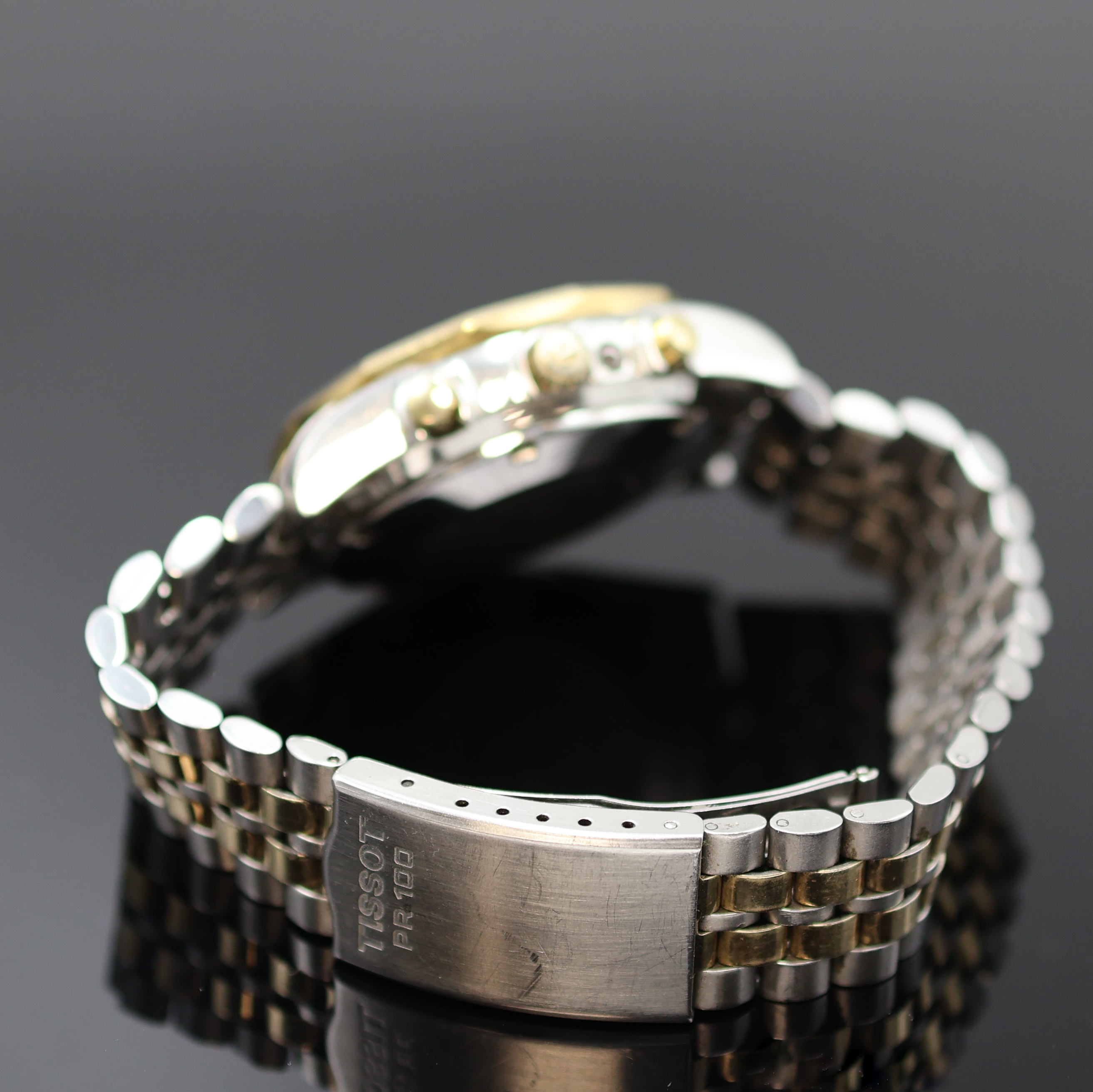 Detail b: TISSOT PR 100 Herrenchronograph in Stahl/ vergoldet, Schweiz um 1980, Automatik, verschr. Geh., 12-eckig facettierte Lünette, orig. Band m. ...
