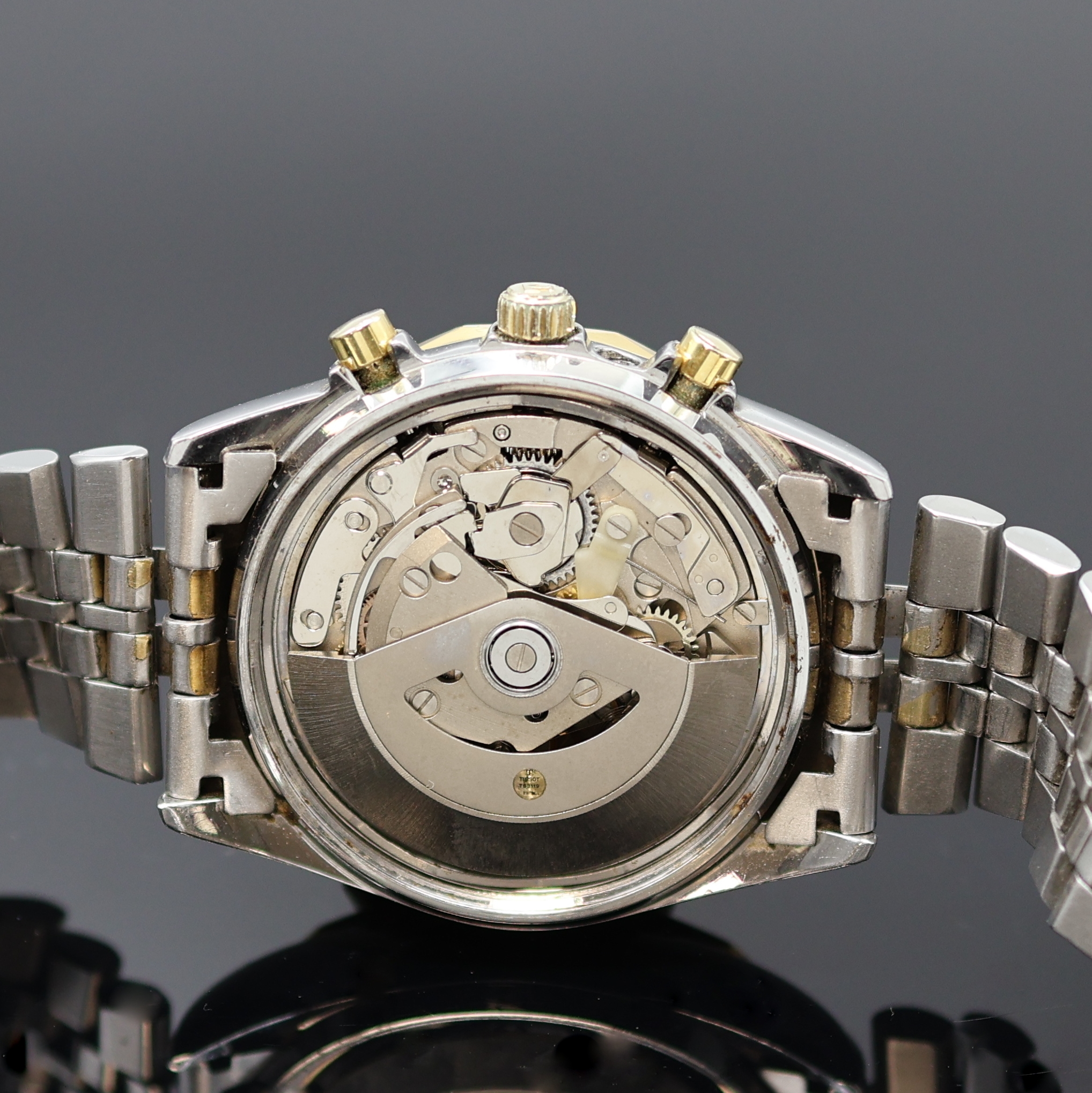 Detail e: TISSOT PR 100 Herrenchronograph in Stahl/ vergoldet, Schweiz um 1980, Automatik, verschr. Geh., 12-eckig facettierte Lünette, orig. Band m. ...