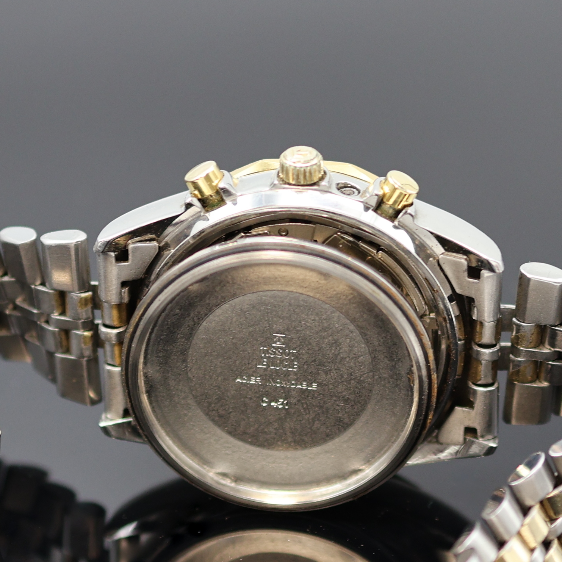 Detail g: TISSOT PR 100 Herrenchronograph in Stahl/ vergoldet, Schweiz um 1980, Automatik, verschr. Geh., 12-eckig facettierte Lünette, orig. Band m. ...