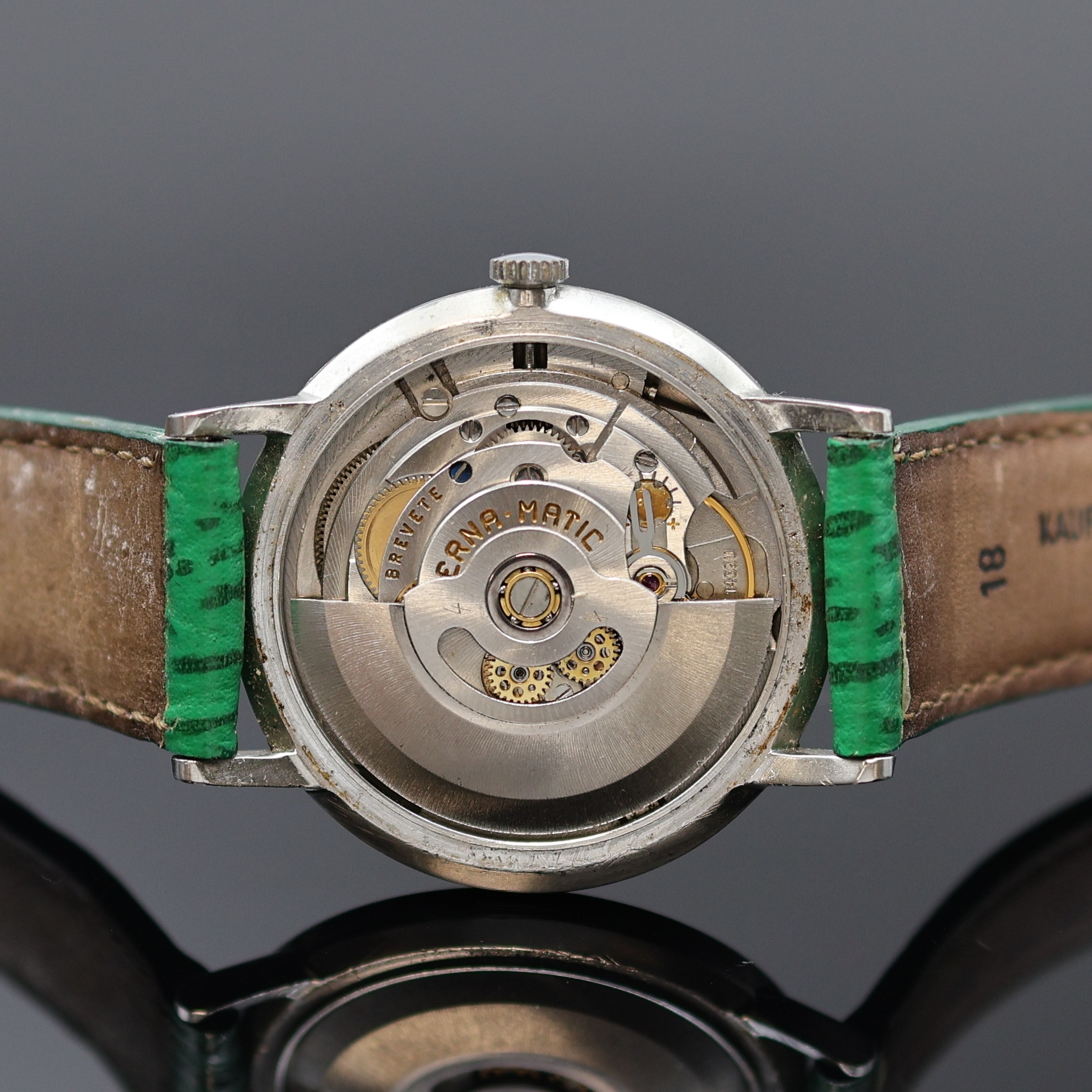 Detail d: ETERNA-MATIC Centenaire Armbanduhr in Stahl, Schweiz um 1965, Automatik, flaches 3-tlg. Geh., Boden u. Glasrand aufgedr., silb. Zifferbl. rest., ...