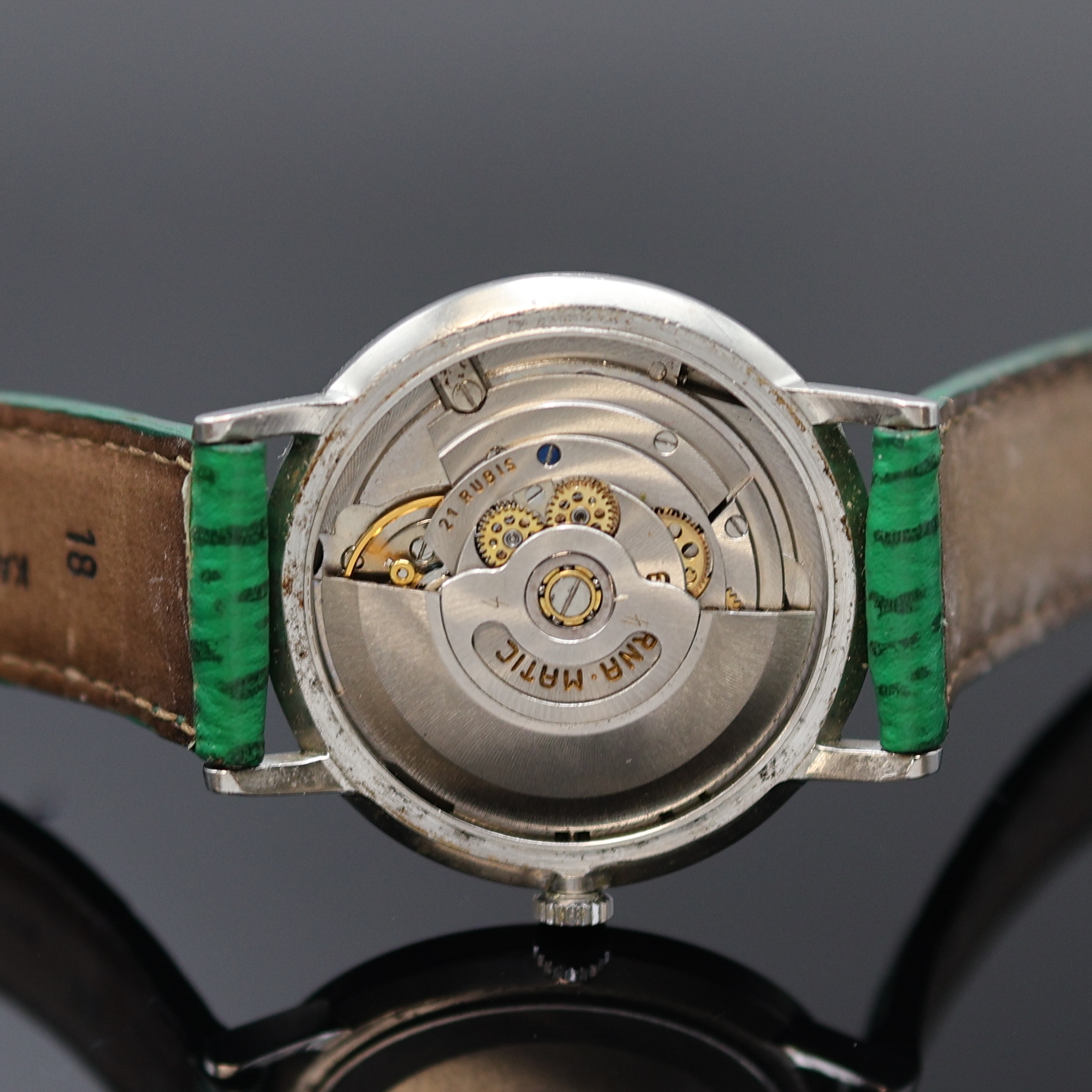 Detail e: ETERNA-MATIC Centenaire Armbanduhr in Stahl, Schweiz um 1965, Automatik, flaches 3-tlg. Geh., Boden u. Glasrand aufgedr., silb. Zifferbl. rest., ...