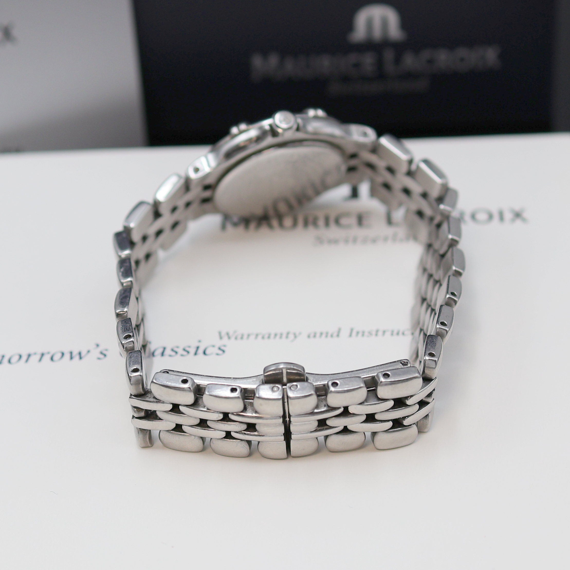 Detail c: MAURICE LACROIX Calypso Damenarmbanduhr Referenz 75344, Schweiz um 2000, quarz, Edelstahlgeh. an orig. Gliederband m. dopp. Faltschl., Boden ...