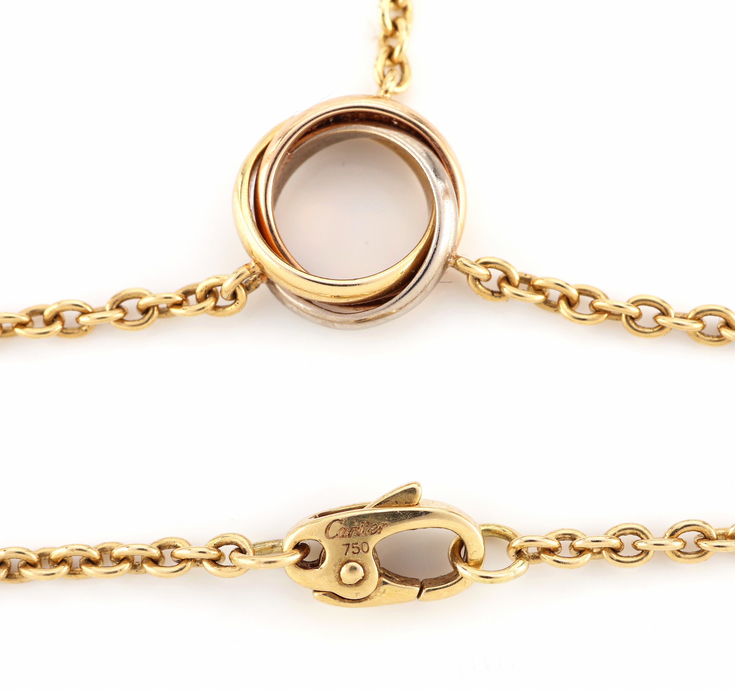 Detail a: 18 kt Gold CARTIER Y-Collier , GG/WG/RG 750/000, Mittelteil mit Trinity Ring, Ende miteiner Trinity Kugel, durch einfädeln in den Ring auch 4-rhg. ...