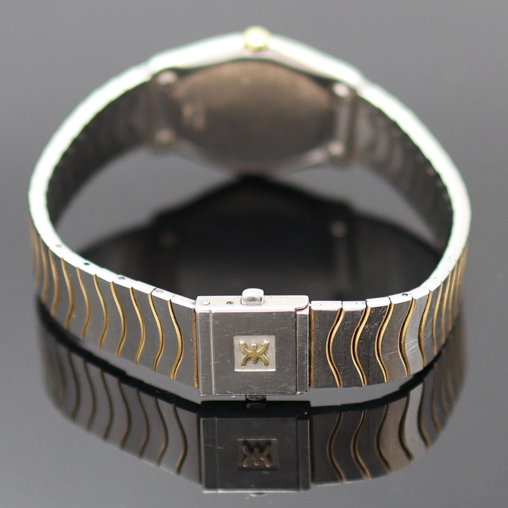 Detail c: EBEL Damenarmbanduhr, Schweiz um 1990, Edelstahl/Gold kombiniert inkl. Wellengliederband m. Kastenschloß, quarz, Lünette gegen Geh. 5-fach ...