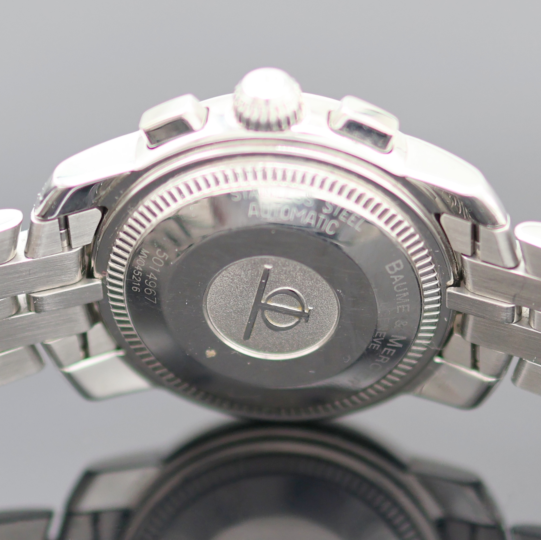 Detail d: BAUME & MERCIER Capeland Herrenchronograph in Stahl Referenz MV045216, Schweiz um 2000, Automatik, Boden u. Krone verschr., orig. Gliederband m. ...