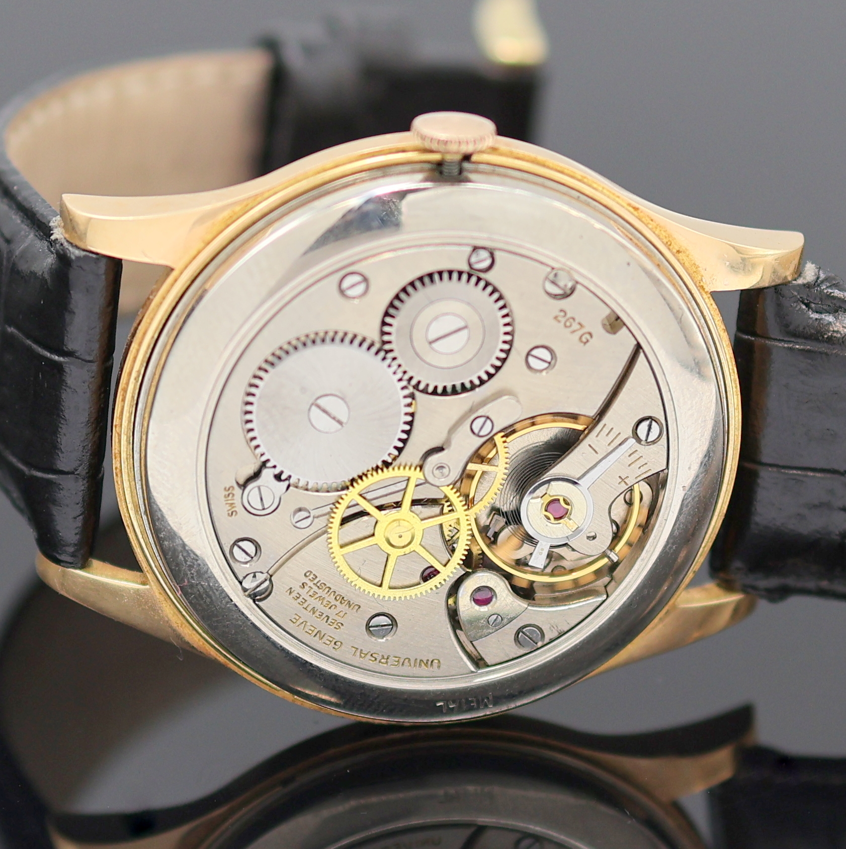 Detail f: UNIVERSAL GENEVE große Herrenarmbanduhr in RG 750/000, Handaufzug, Schweiz um 1949, Einschalengeh., Glasrand aufgedr., Zifferbl. rest., Anz. v. ...