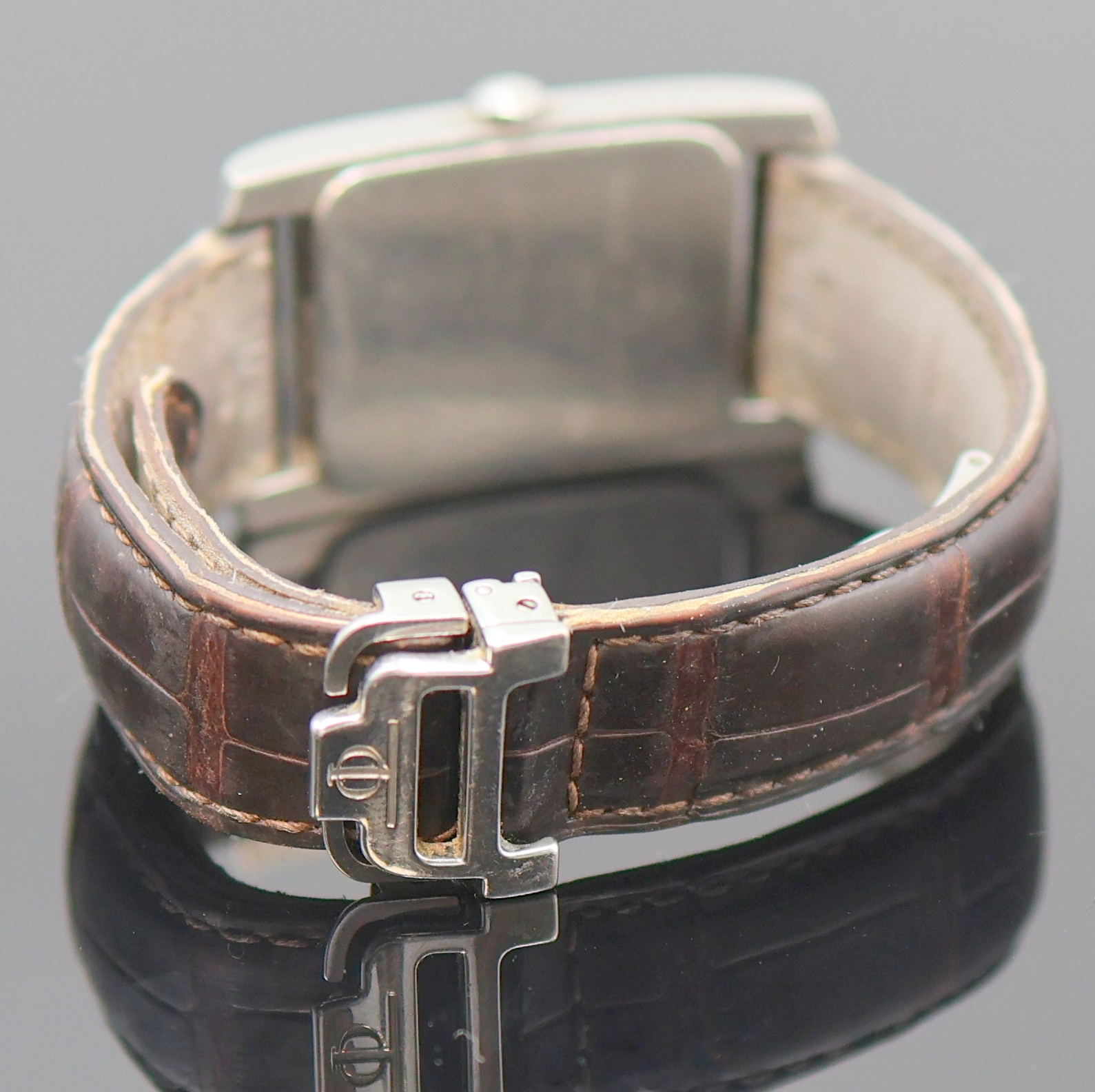 Detail c: BAUME & MERCIER Armbanduhr Serie Hampton in Stahl, Schweiz um 2000, quarz, Boden aufgedr., neutr. Lederband m. orig. Faltschl., kupferfarb. Zifferbl. ...