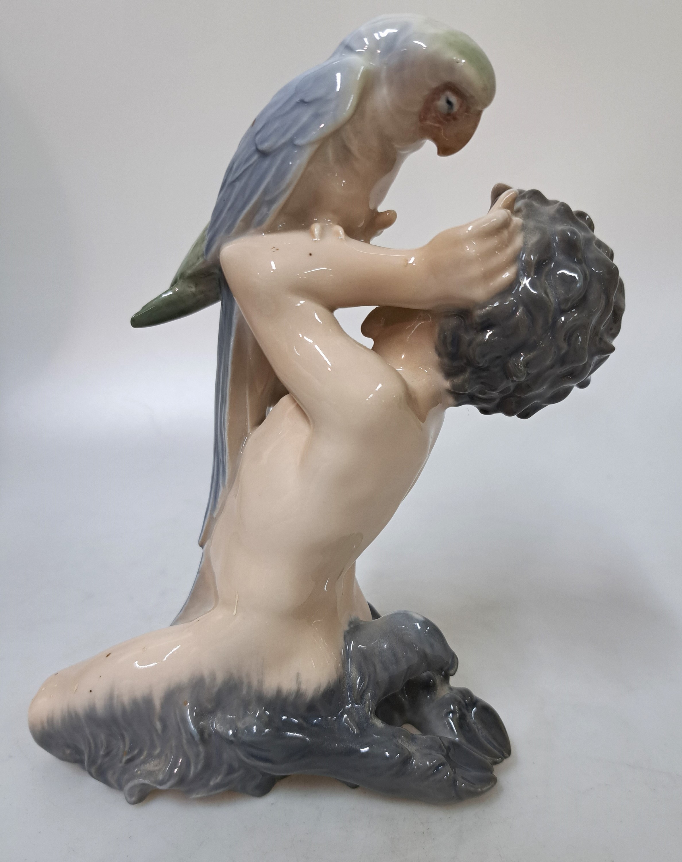 Detail b: Drei Porzellanfiguren, Royal Copenhagen, 20. Jh., Unterglasurbemalung, sitzender Faun mit Panflöte, H. ca. 13 cm, sitzender Faun mit Bär spielend, ...