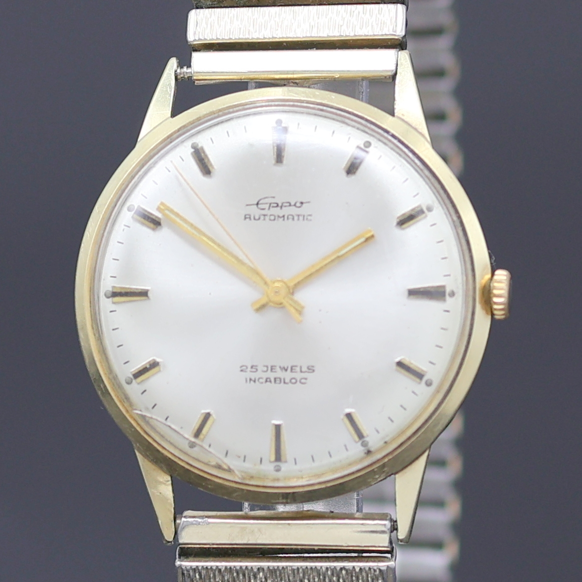 Detail a: EPPO Herrenarmbanduhr in GG 585/000, Deutschland um 1965, Automatik, 2-tlg. Geh., Boden aufgedr., silb. Zifferbl., gold. Indizes u. Zeiger, ...