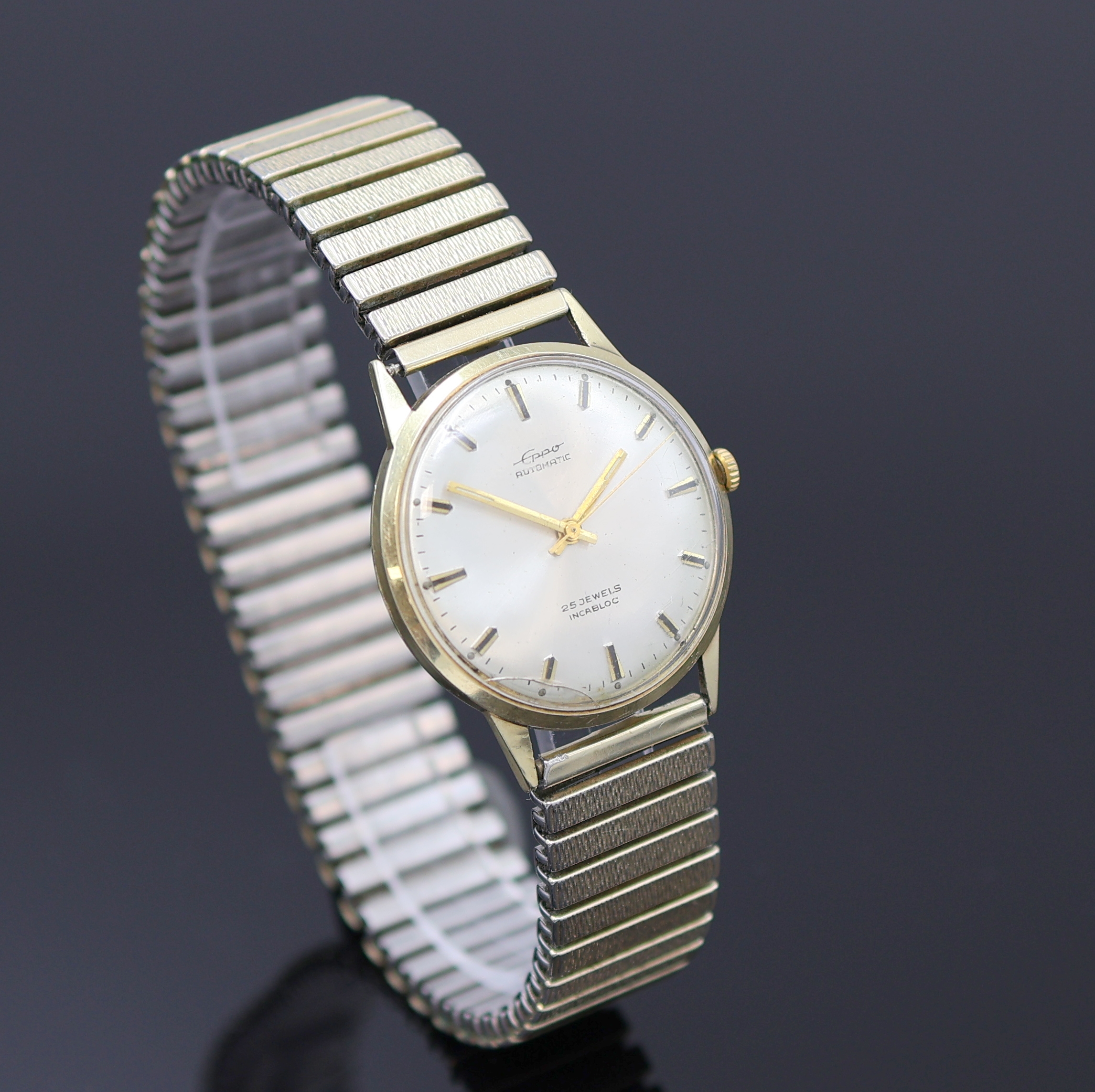 Detail b: EPPO Herrenarmbanduhr in GG 585/000, Deutschland um 1965, Automatik, 2-tlg. Geh., Boden aufgedr., silb. Zifferbl., gold. Indizes u. Zeiger, ...