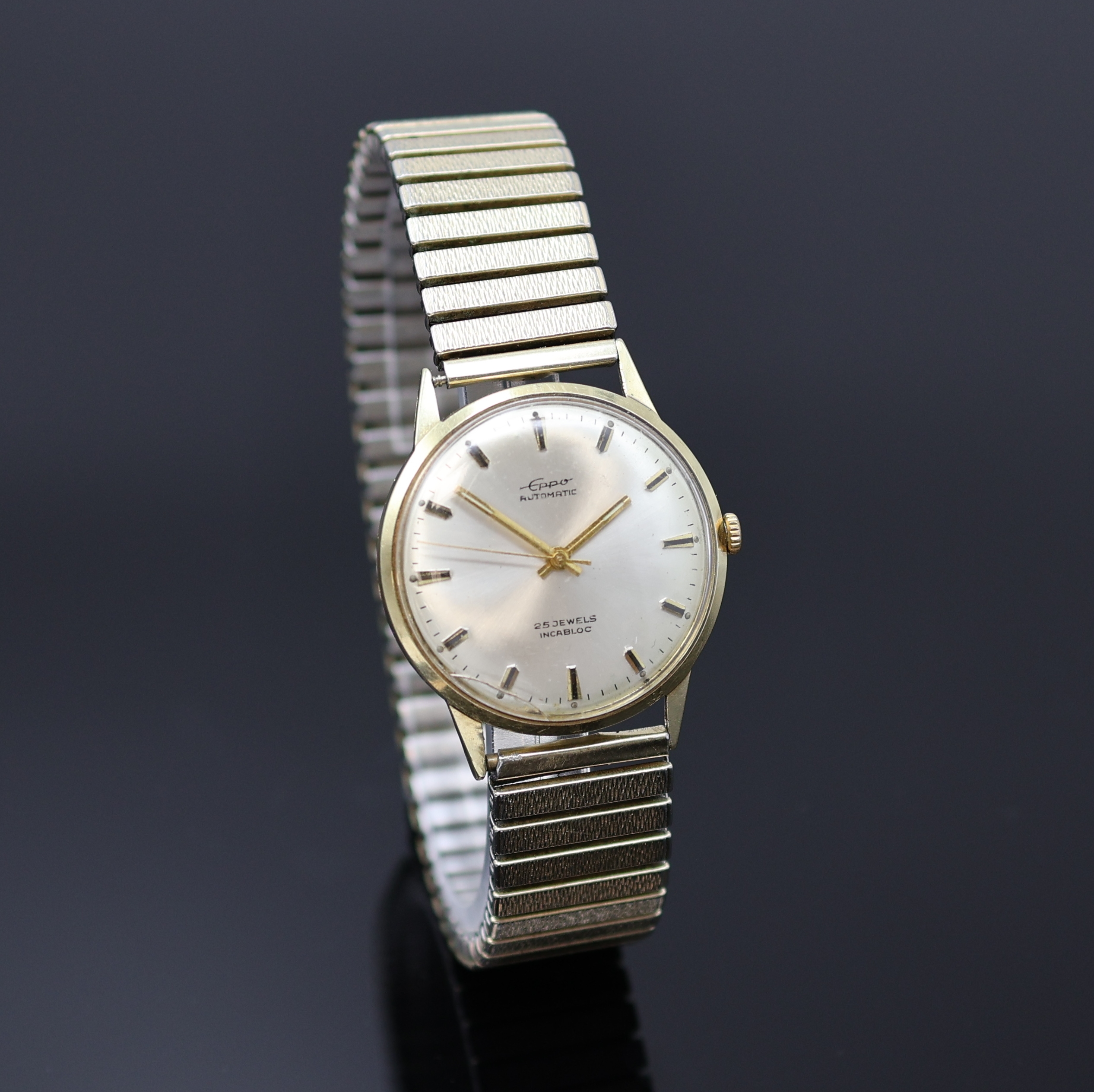 Detail c: EPPO Herrenarmbanduhr in GG 585/000, Deutschland um 1965, Automatik, 2-tlg. Geh., Boden aufgedr., silb. Zifferbl., gold. Indizes u. Zeiger, ...