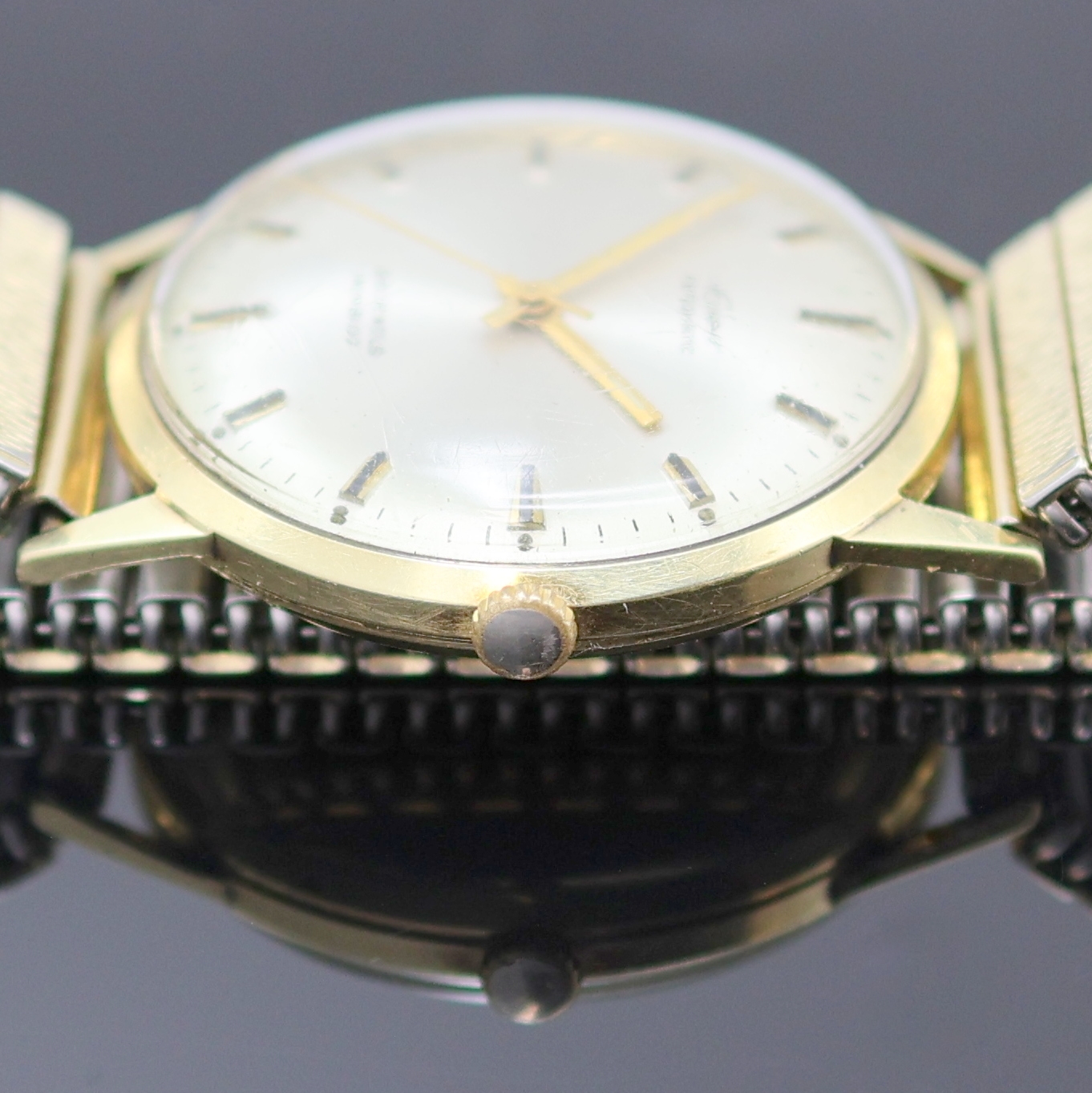 Detail d: EPPO Herrenarmbanduhr in GG 585/000, Deutschland um 1965, Automatik, 2-tlg. Geh., Boden aufgedr., silb. Zifferbl., gold. Indizes u. Zeiger, ...