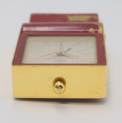 26987081b - JAEGER 2-Tage Reisewecker, Schweiz um 1960, rot lack. Messinggeh. ber., z. T. verg., ...