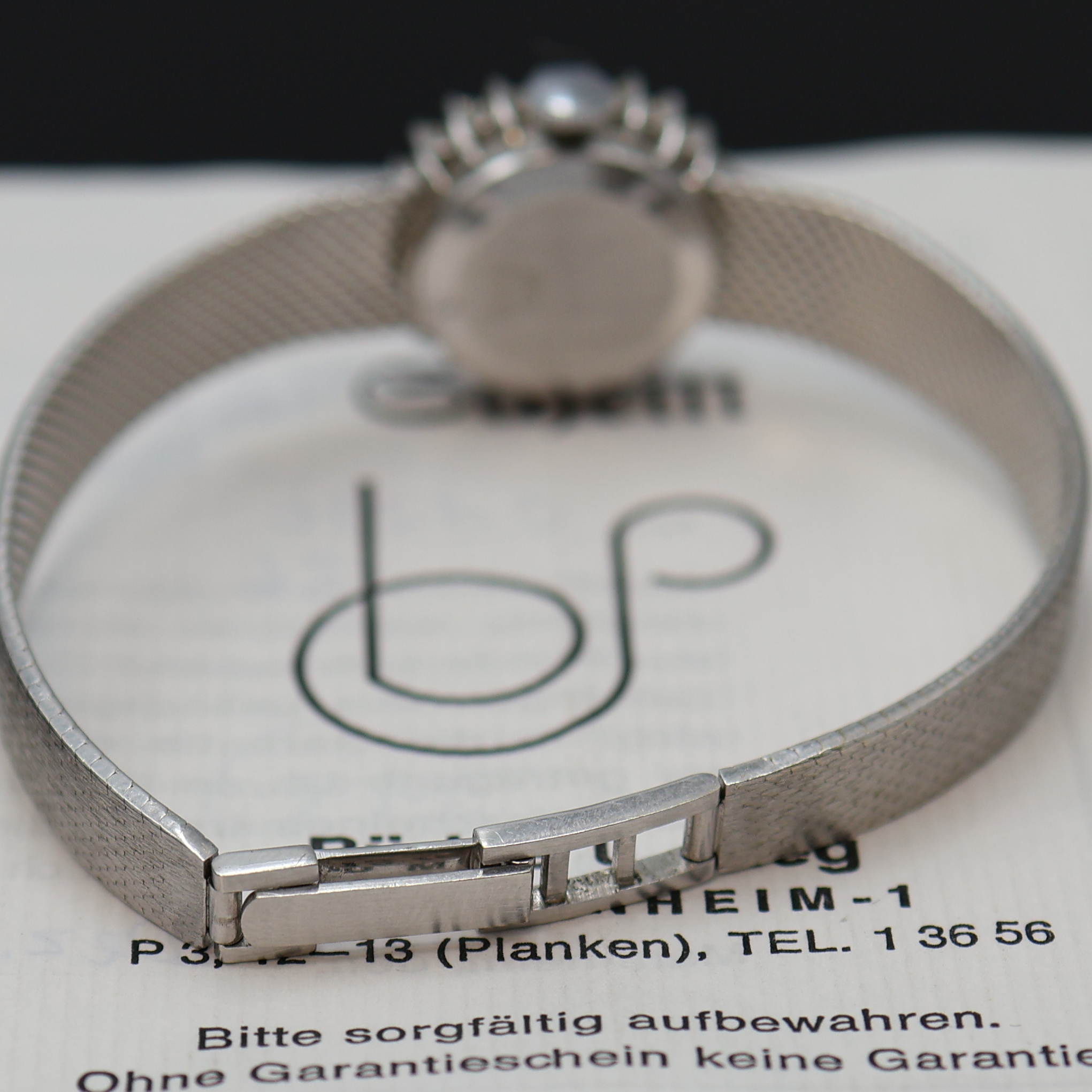 Detail b: METEOR diamantbesetzte Damenarmbanduhr in WG 585/000, Schweiz um 1975, Handaufzug, 2-tlg. Geh. m. Milanaiseband, Boden aufgedr., silb. Zifferbl., ...