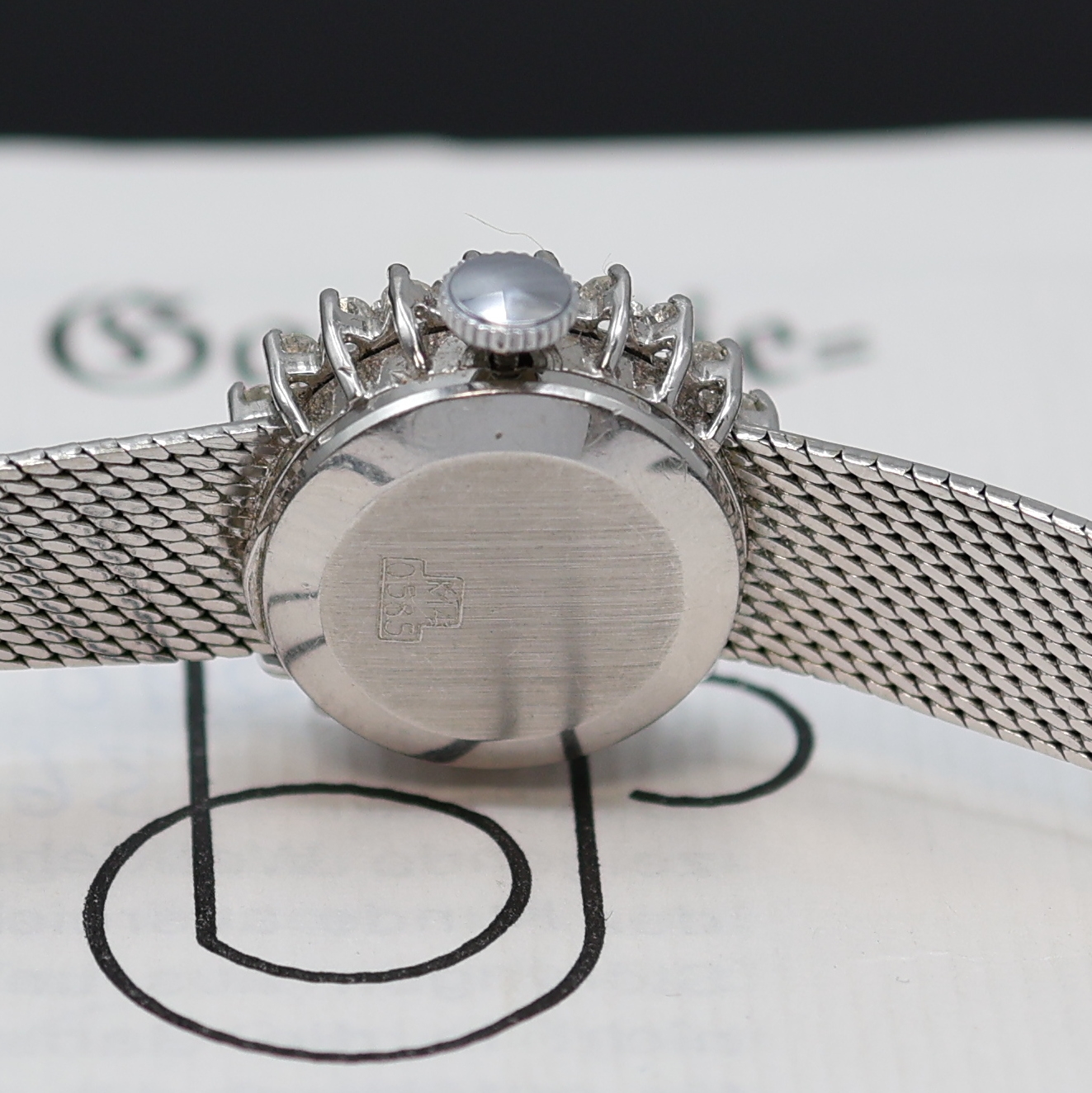 Detail d: METEOR diamantbesetzte Damenarmbanduhr in WG 585/000, Schweiz um 1975, Handaufzug, 2-tlg. Geh. m. Milanaiseband, Boden aufgedr., silb. Zifferbl., ...
