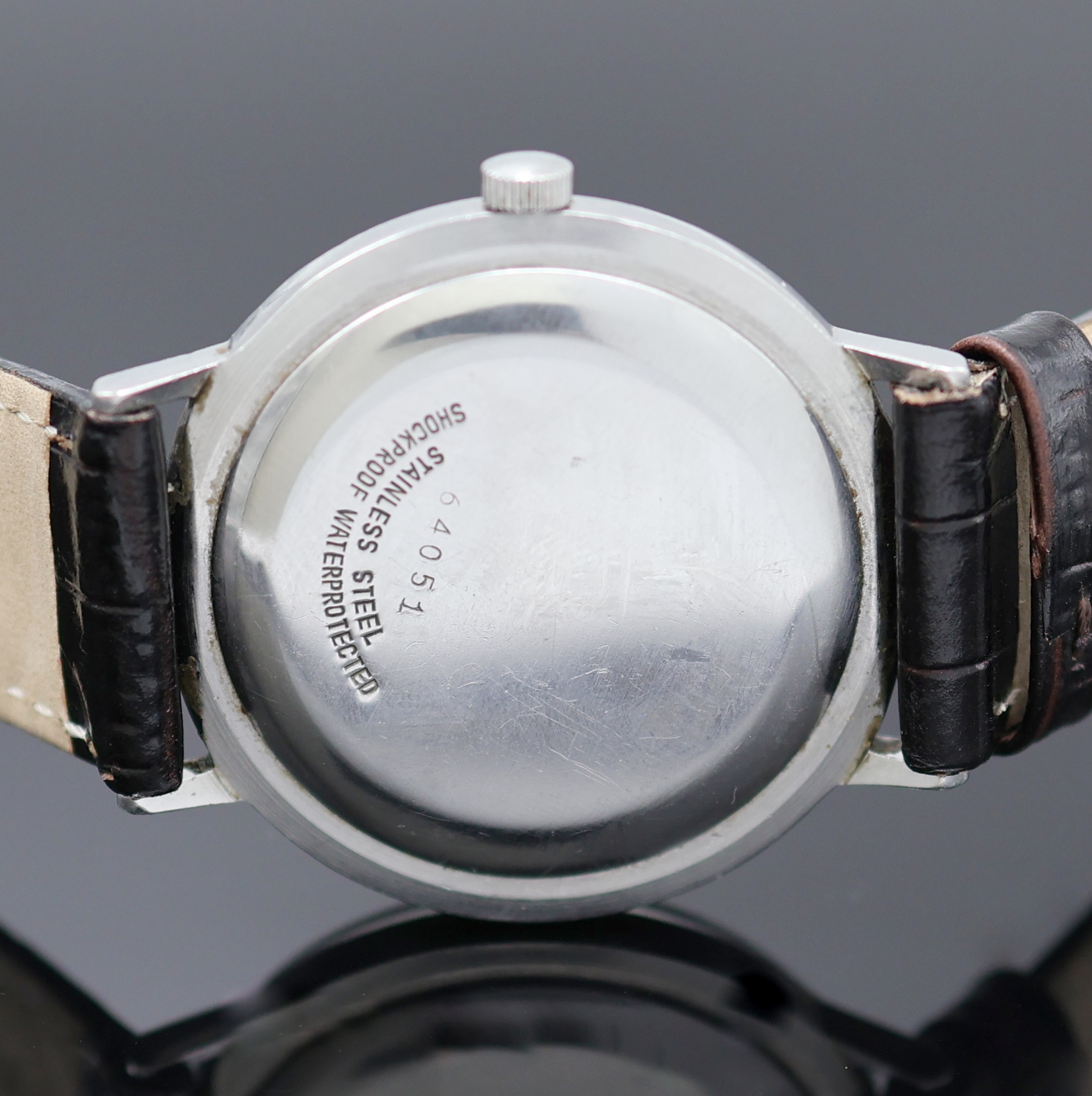 Detail c: JUNGHANS Chronometer in Stahl, Deutschland um 1962, Handaufzug, 2-tlg. Geh., Boden aufgedr., silb. Zifferbl. m. aufgel. silb. Indizes, silb. Zeiger, ...