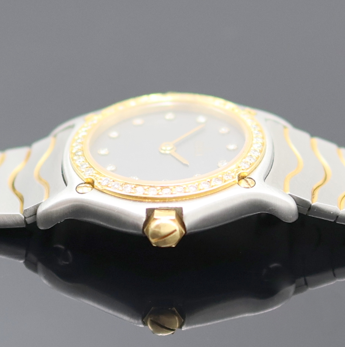 Detail c: EBEL Damenarmbanduhr Referenz 166902, Schweiz 1980er Jahre, quarz, zweit. Geh. in Edelstahl/Gold kombiniert, Wellengliederband m. Kastenschl., 5-fach ...