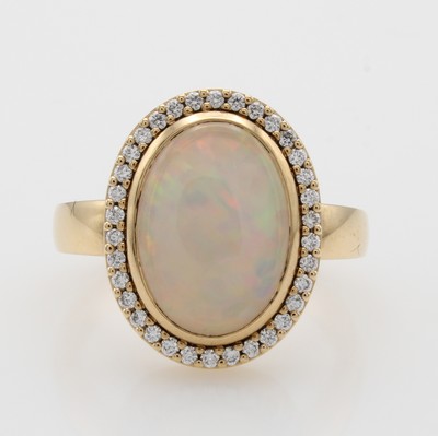 Image Ring mit Opal und Brillanten, RG 750/000, Opal ca. 2.59 ct umgeben von 34 Brill. zus. ...